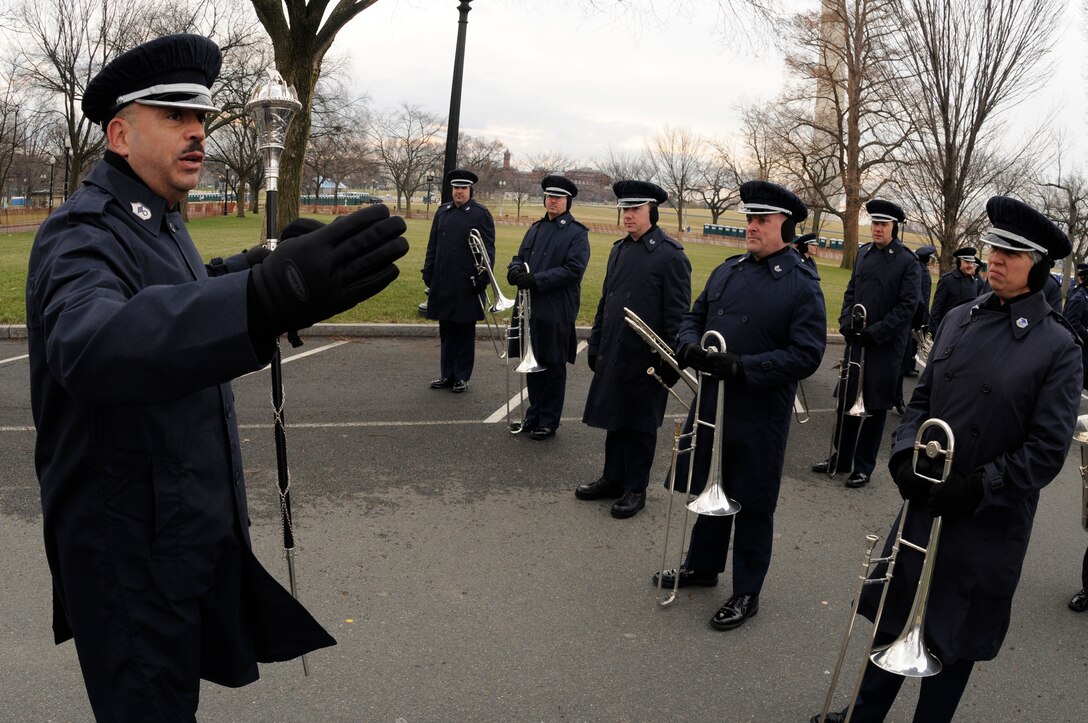 Chief Master Sgt. Edward J. Teleky, drum major and director of the United States Air Force Band’s Ceremonial Brass, explains the spacing needed between elements for the Air Force Band flight, which will be marching down Constitution Avenue Jan. 11 in Washington during a practice run of the inauguration parade for President-elect Barack Obama. (U.S. Air Force photo by Staff Sgt. Dan DeCook)