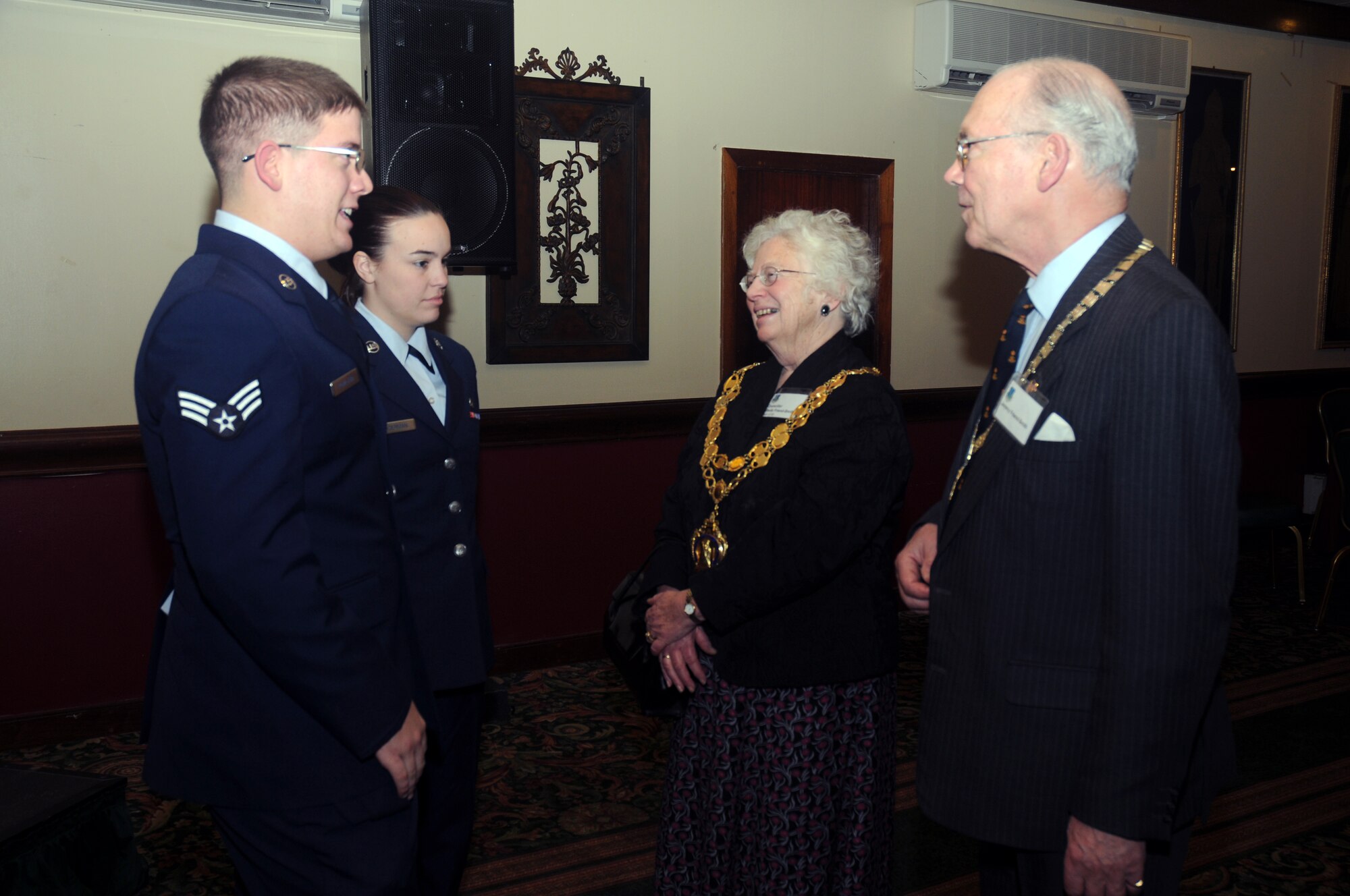 Airmen from the 48th Fighter Wing discuss their time at RAF Lakenheath with local community leaders at the Winter Reception Jan. 9. The Winter Reception provides an opportunity to exchange ideas and experiences as well as foster friendships between the key leaders in the local civilian community and the RAF Lakenheath base community. (U.S. Air Force Photo by Senior Airman Kristopher Levasseur)