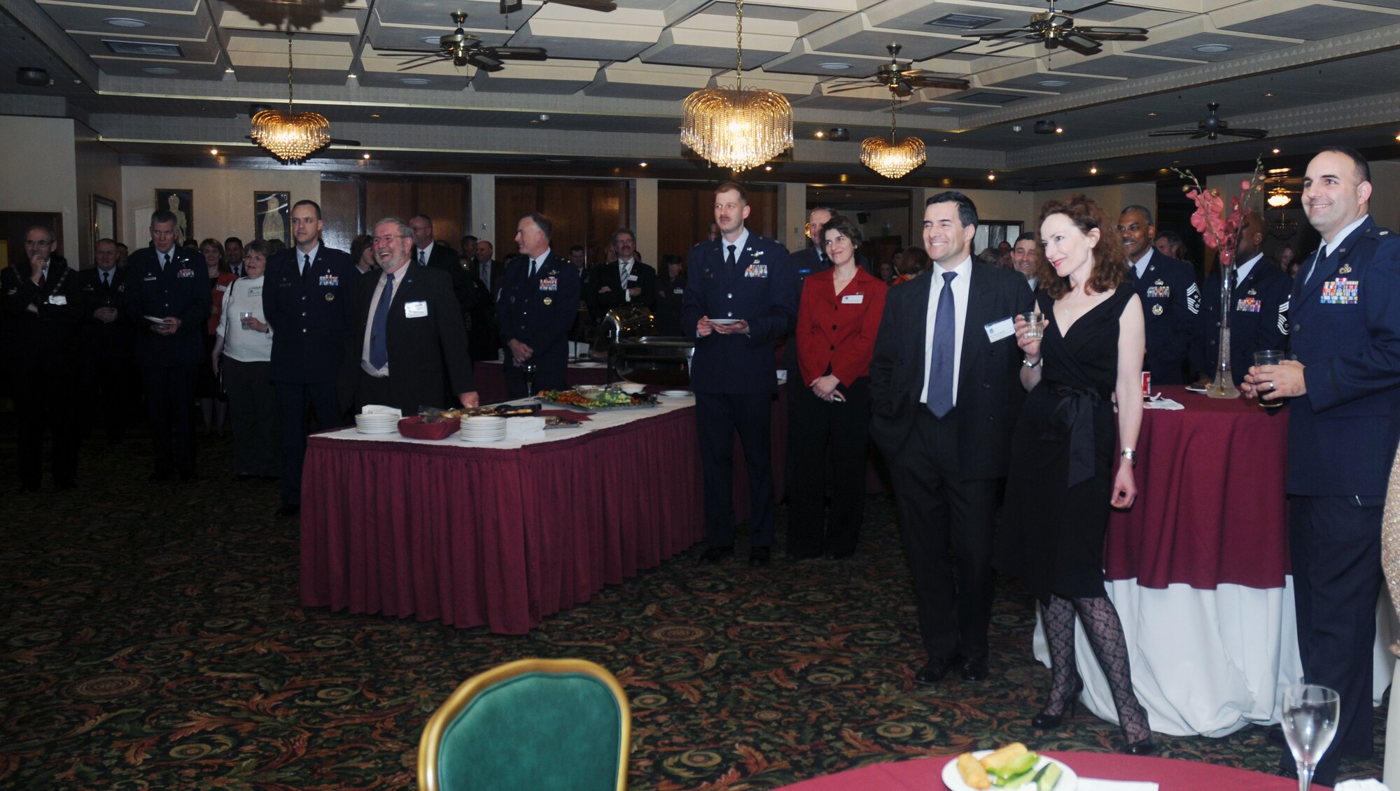 Members of the East Anglian community and 48th Fighter Wing personnel listen intently to Col. Jay Silveria, 48th FW commander as he welcomes participants in this year’s Winter Reception Jan. 9 at RAF Lakenheath, England. The Winter Reception provides an opportunity to exchange ideas and experiences as well as foster friendships between the key leaders in the local civilian community and the RAF Lakenheath base community. (U.S. Air Force Photo by Senior Airman Kristopher Levasseur)