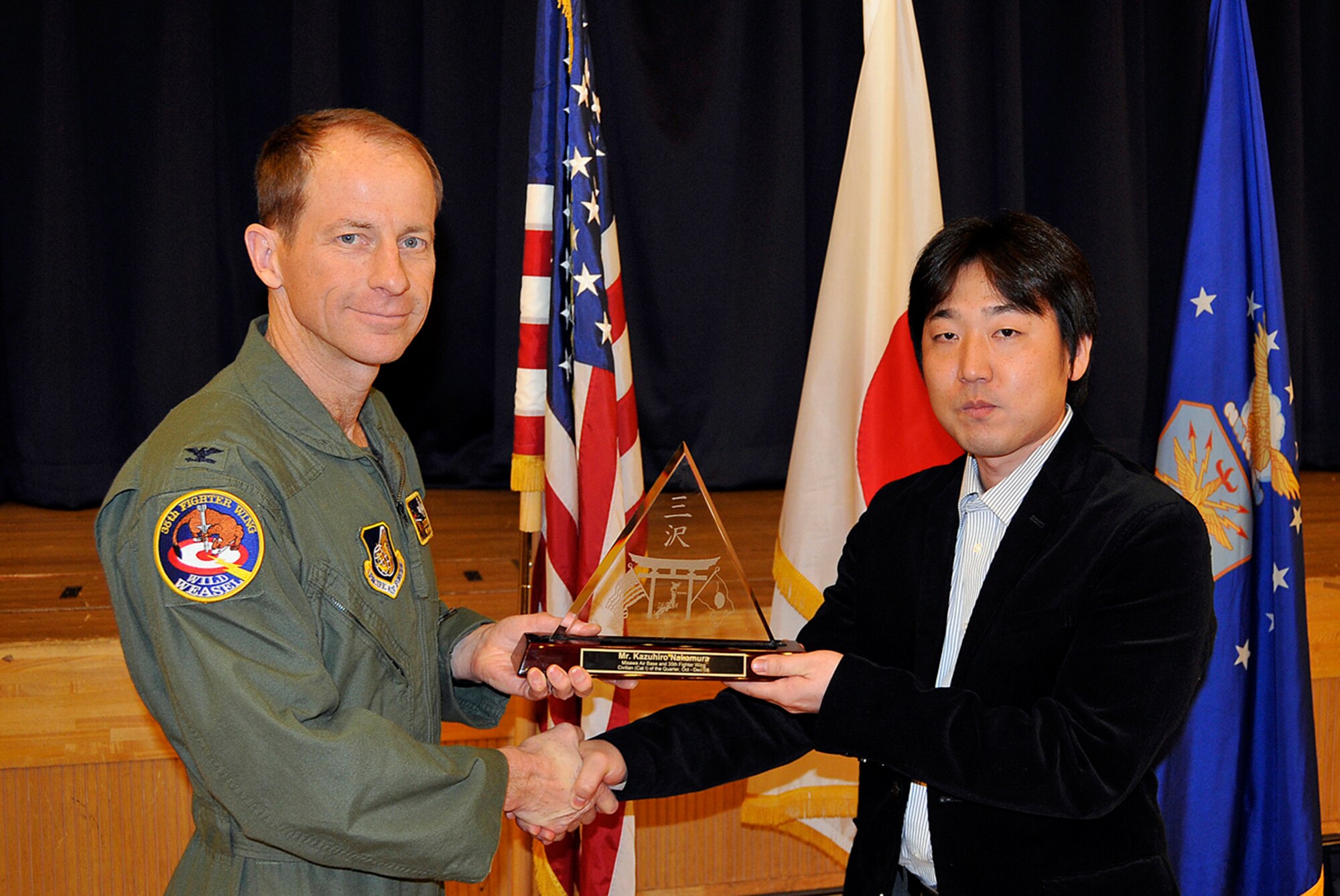 MISAWA AIR BASE, Japan -- Kazuhiro Nakamura, 35th Contracting Squadron, receives 35th Fighter Wing Civilian of the Quarter Category 1 during the wing quarterly award luncheon Jan. 9, 2009. Mr. Nakamura a native of Hachinohe, Aomori Prefecture, Japan, and has worked at Misawa for one year. (U.S. Air Force photo by Senior Airman Chad Strohmeyer)