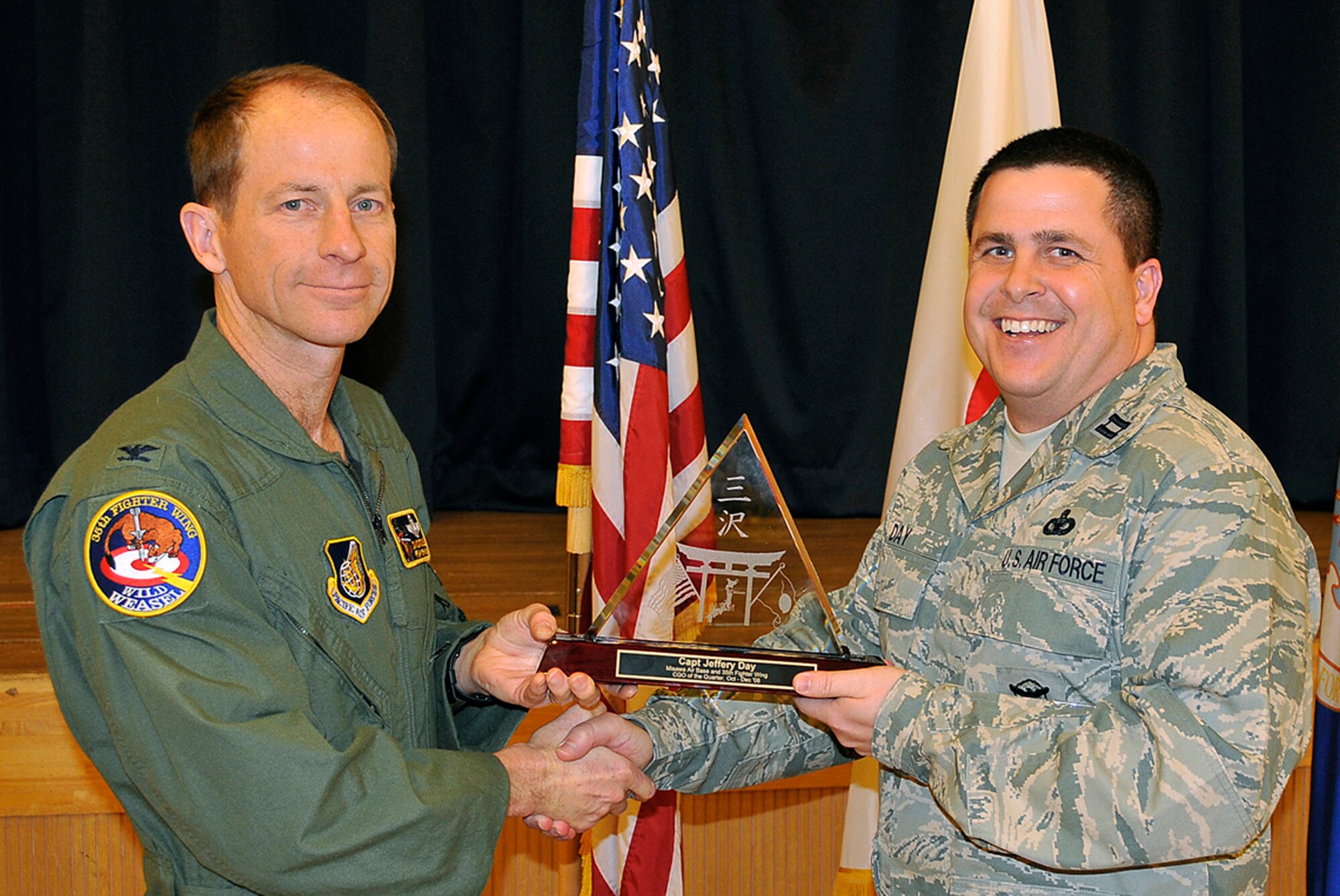 MISAWA AIR BASE, Japan -- Capt. Jeffery Day, 35th Security Forces Squadron, receives 35th Fighter Wing CGO of the Quarter during the wing quarterly award luncheon Jan. 9, 2009. Captain Day is a native of Detroit, Mich., and has been in the Air Force for more than 20 years. (U.S. Air Force photo by Senior Airman Chad Strohmeyer)