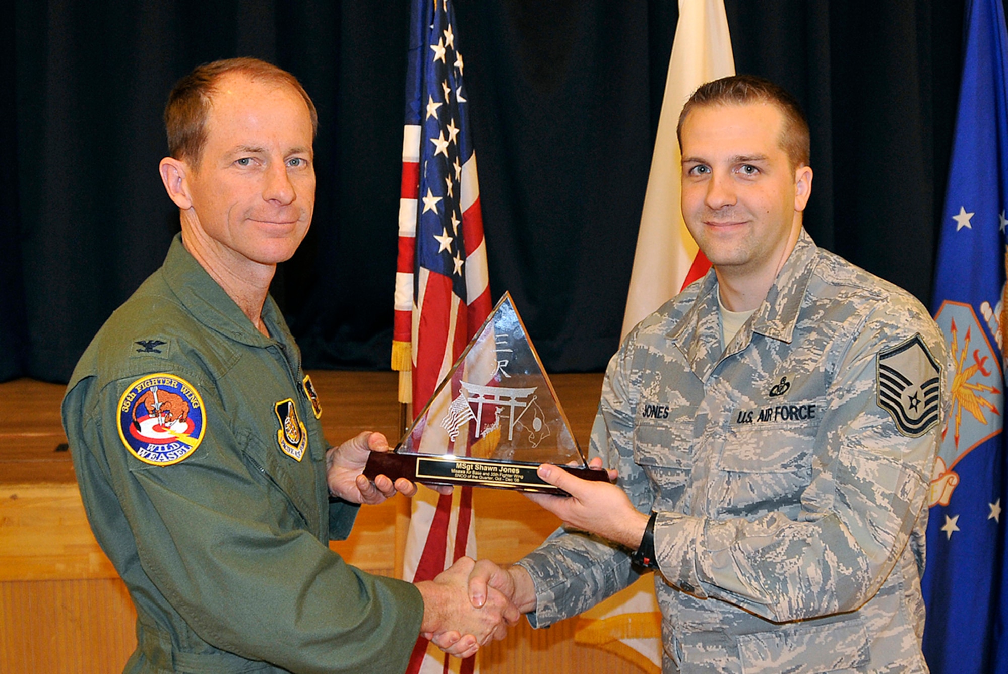 MISAWA AIR BASE, Japan -- Master Sgt. Shawn Jones, 35th Operations Support Squadron, receives 35th Fighter Wing Senior NCO of the Quarter during the wing quarterly award luncheon Jan. 9, 2009. Sergeant Jones is a native of Huber Heights, Ohio, and has been in the Air Force for 12 years. (U.S. Air Force photo by Senior Airman Chad Strohmeyer)