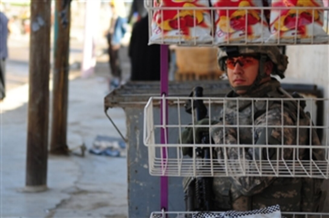 U.S. Army Spc. Wilfredro Cruz assigned to Headquarters and Headquarters Troop, 3rd Squadron, 4th Calvary Regiment, 3rd Brigade Combat Team, 25th Infantry Division provides security during a patrol in Balad, Iraq, on Jan. 8, 2009.  