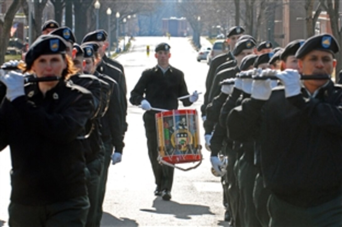 U.S. Army Staff Sgt. Brian L. Barnhart, a snare drummer assigned to the 3rd U.S. Infantry Regiment's Fife and Drum Corps, trails the ensemble down Sheridan Avenue, Jan. 9, 2009, on Fort Myer, Va., during rehearsal for President-elect Barack Obama’s inaugural parade Jan. 20 in Washington, D.C. Fifty-eight members of the Fife and Drum Corps will be marching in the inaugural parade - the largest number of members in the Fife and Drum Corps' history.