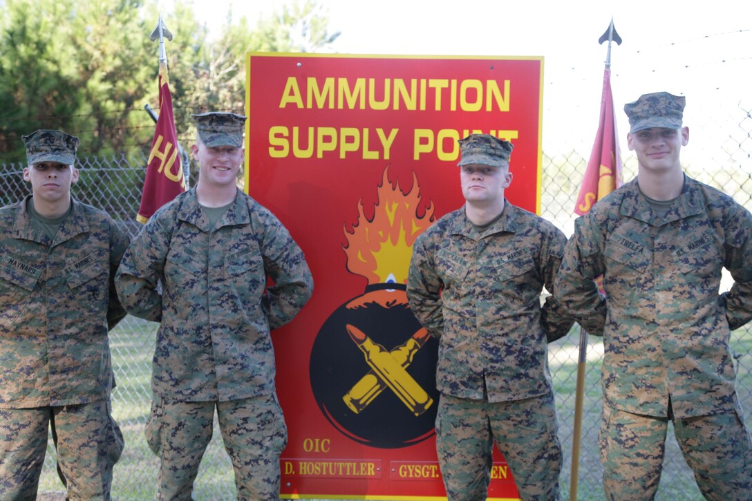 (from left to right) Pfc. Brian Maynard, Cpl. Alexander Long,  Lance Cpl. Matt Buckalew and Lance Cpl. Bryan Trefla are just of few of the Marines who work in the highly secured Ammunition Supply Point located in Page Field.