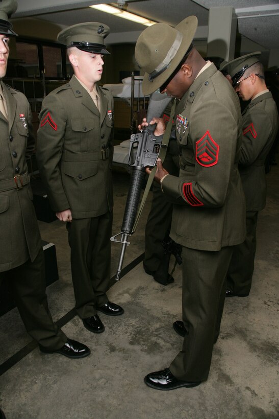 Pfc. Nicholas A. Jerkovich, of Dayton, Ohio, from Platoon 2004 recites his rifle serial number while Drill Instructor Staff Sgt. Frank Barra, From Edroy Texas verifies.