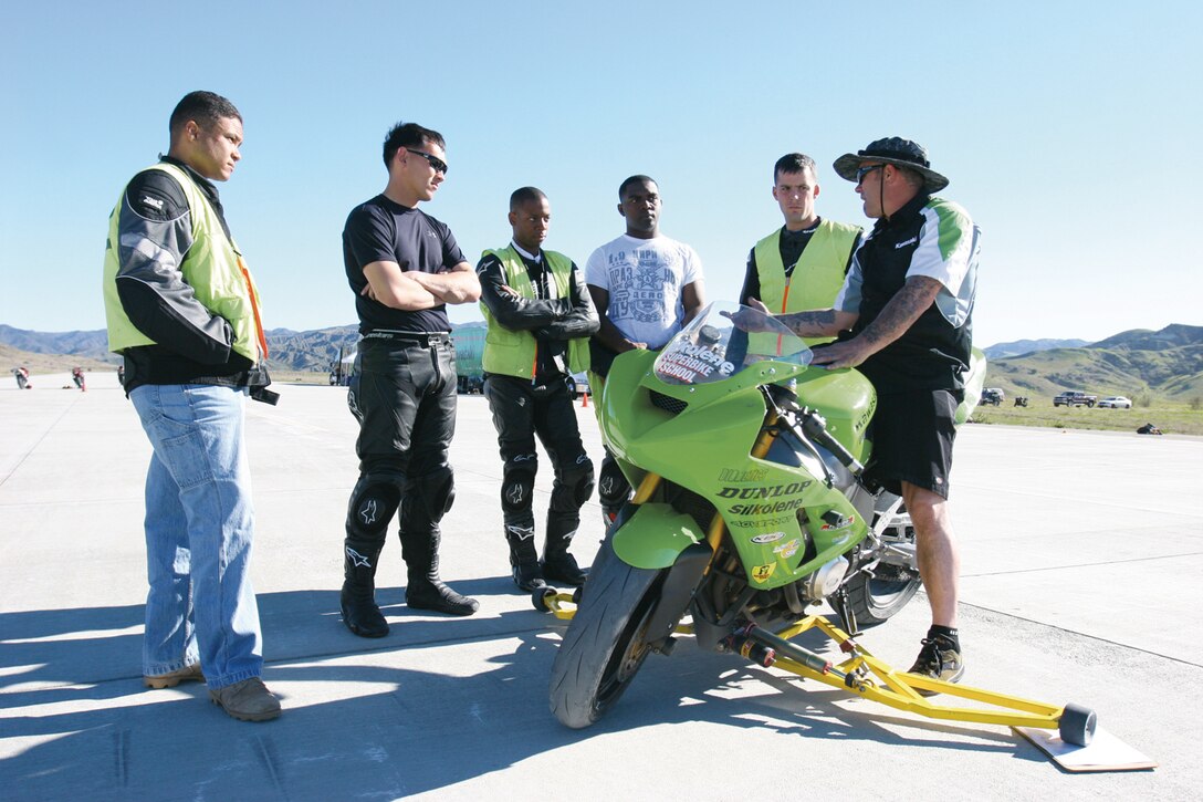 Lonnie Etter, Class II instructor from the California Superbike School is giving a class to service members on the cornering techniques Tuesday at the Helicopter Outlying Landing Field on Marine Corps Base Camp Pendleton.