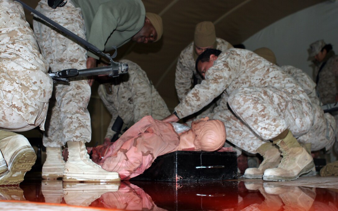 Marines from the 26th Marine Expeditionary Unit's Command Element take part in a medical refresher course at Camp Buehring, Kuwait, Jan.  14, 2009.  The Marines provided care to simulated casualties in a medical training facility.  The 26th MEU is in Kuwait for sustainment training.