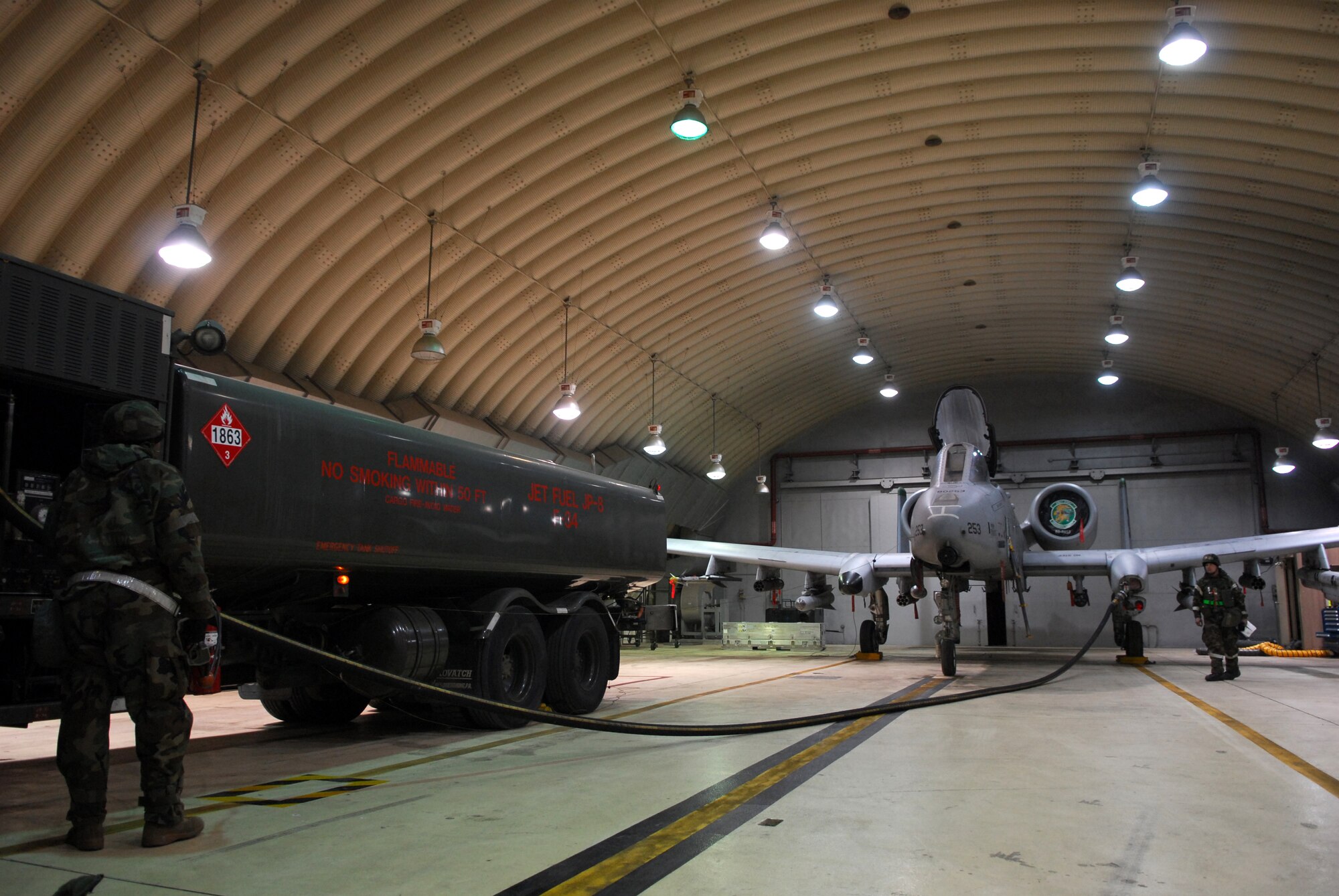 Senior Airman James Fox (left), and Staff Sgt. Shawn Harris fuel up an A-10 Thunderbolt II during Exercise Beverly Bulldog 09-01 Jan. 14 at Osan AB. The 51st Fighter Wing is currently undergoing a week-long Operational Readiness Exercise to test its ability to conduct war time missions. Airman Fox is assigned to the 51st Logistics Readiness Squadron and Sergeant Harris is assigned to the 25th Aircraft Maintenance Unit. (U.S. Air Force photo by Senior Airman Christopher Boitz)