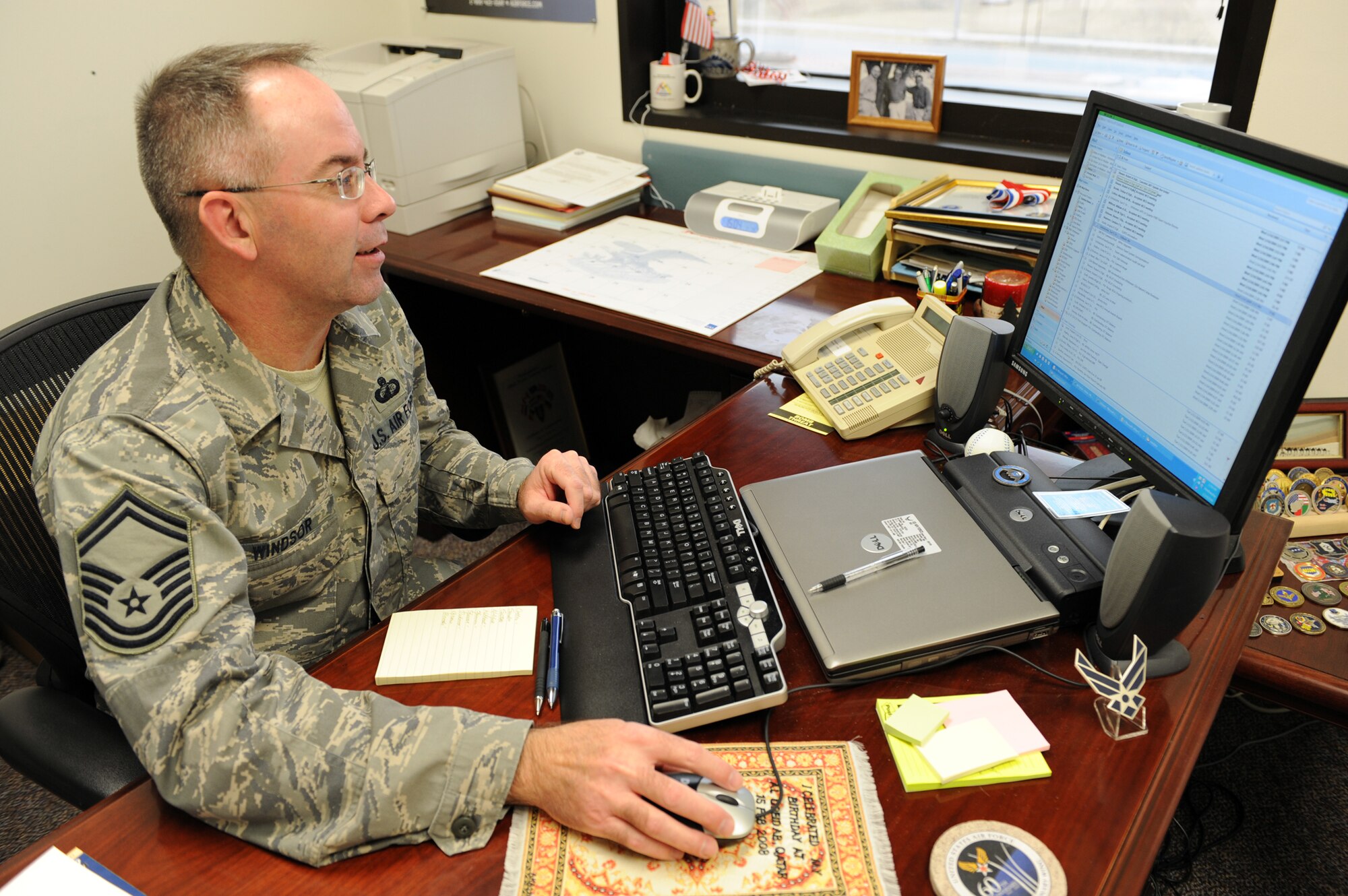WHITEMAN AIR FORCE BASE, Mo. – Senior Master Sgt. Michael Windsor, 509th Comptroller Squadron superintendent, checks his e-mail Jan 14. He became the first Air Force recipient of the U.S .Treasury Cash Management Service Medal of Honor Dec. 11. The U.S. Treasury Cash Management Service Medal of Honor is awarded for outstanding achievement and unparalleled service to the U.S. Treasury Cash Management Service. (U.S. Air Force photo/Senior Airmen Stephen Linch)