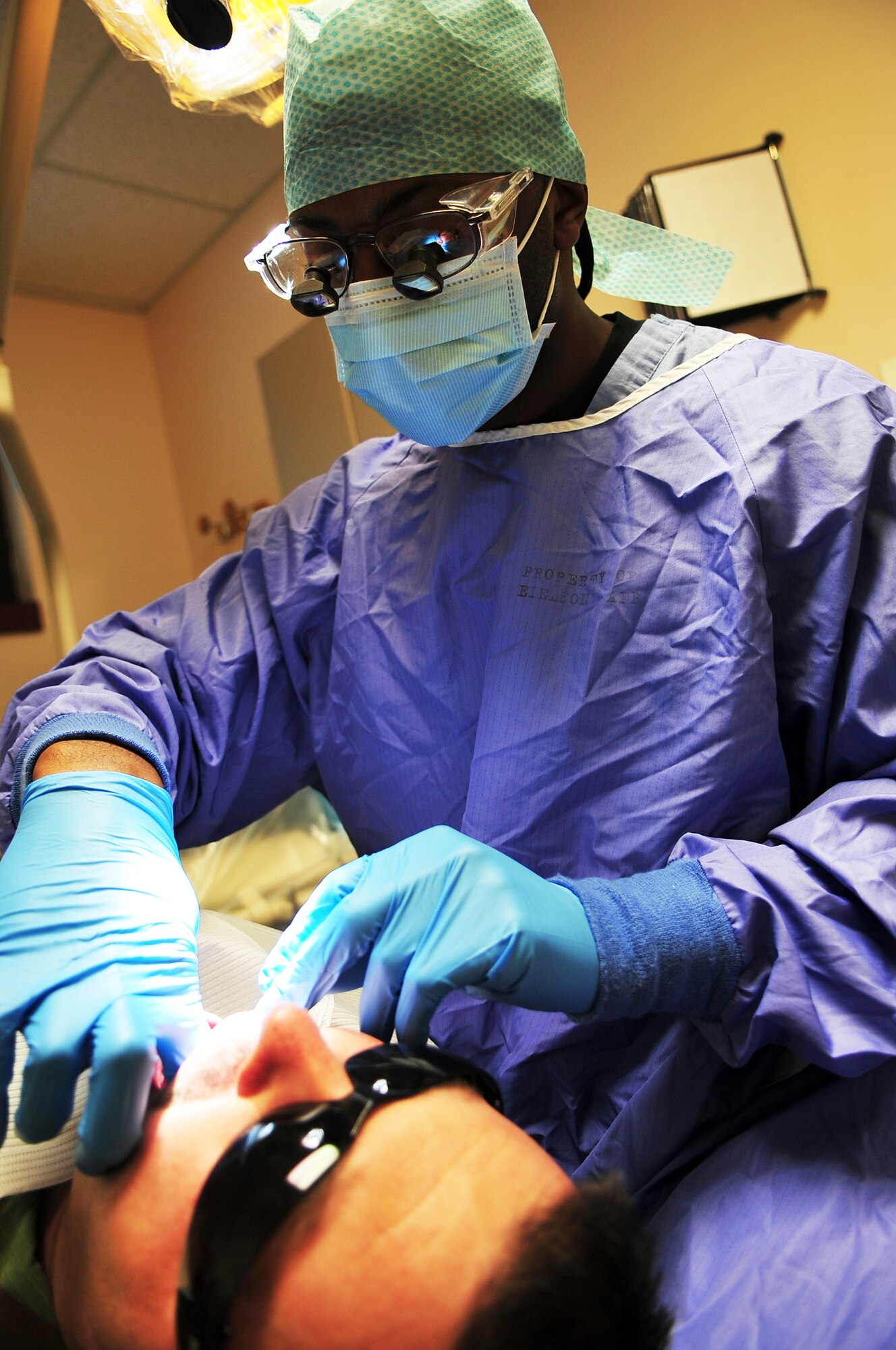 Tech. Sgt. Aaron Gause, 354th Fighter Wing Dental Technician, inspects patients' gums during a routine checkup Jan. 13 at the 354th Medical Group Dental Clinic. Regular dental appointments will help diagnose oral problems early and may lead to the prevention of more serious issues. (U.S. Air Force photo/Airman 1st Class Willard E. Grande II)