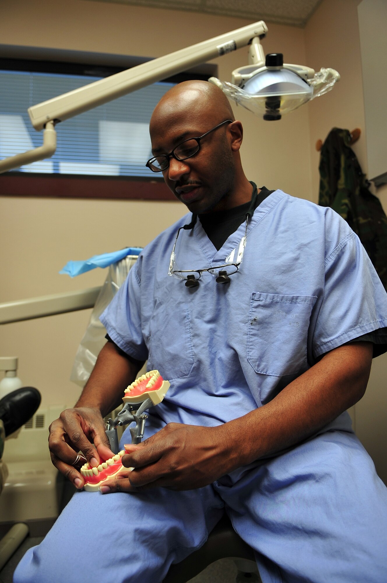 Tech. Sgt. Aaron Gause, 354th Fighter Wing Dental Technician, demonstrates proper mouth care procedures Jan. 13 at the 354th Medical Group Dental Clinic. Making sure all surfaces of your teeth are being brushed is vital to proper oral hygiene. (U.S. Air Force photo/Airman 1st Class Willard E. Grande II)