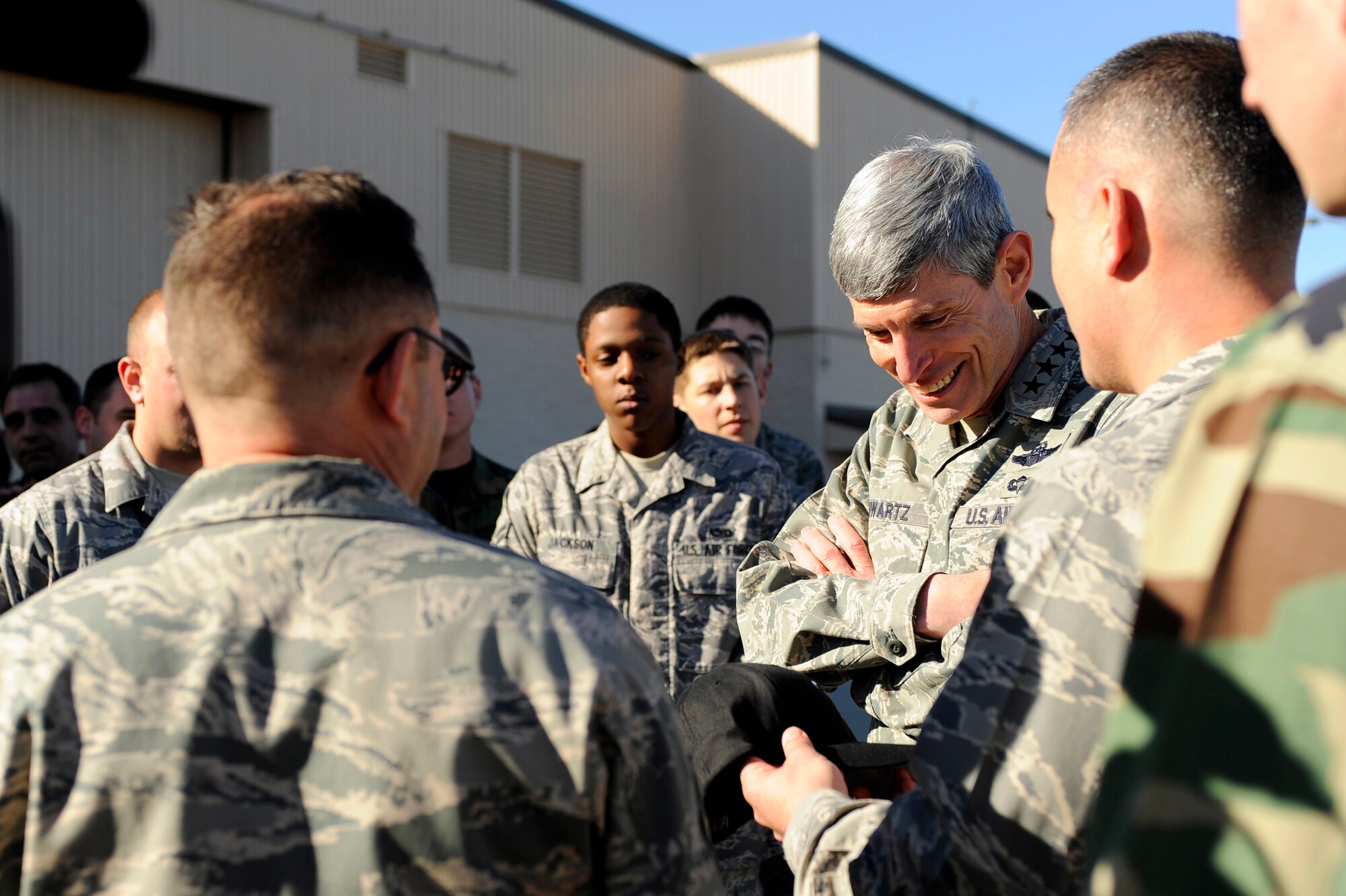 HURLBURT FIELD, Fla. -- Gen. Norton A. Schwartz, Chief of Staff of the U.S. Air Force, Washington, D.C., receives a hat from Capt. Robert Carreiro, 1st Special Operation Aircraft Maintenance Squadron, as a memento of his visit here, Jan. 9. The General Schwartz met with Airmen assigned to the 15th Aircraft Maintenance Unit and toured a PC-12 Pilatus.