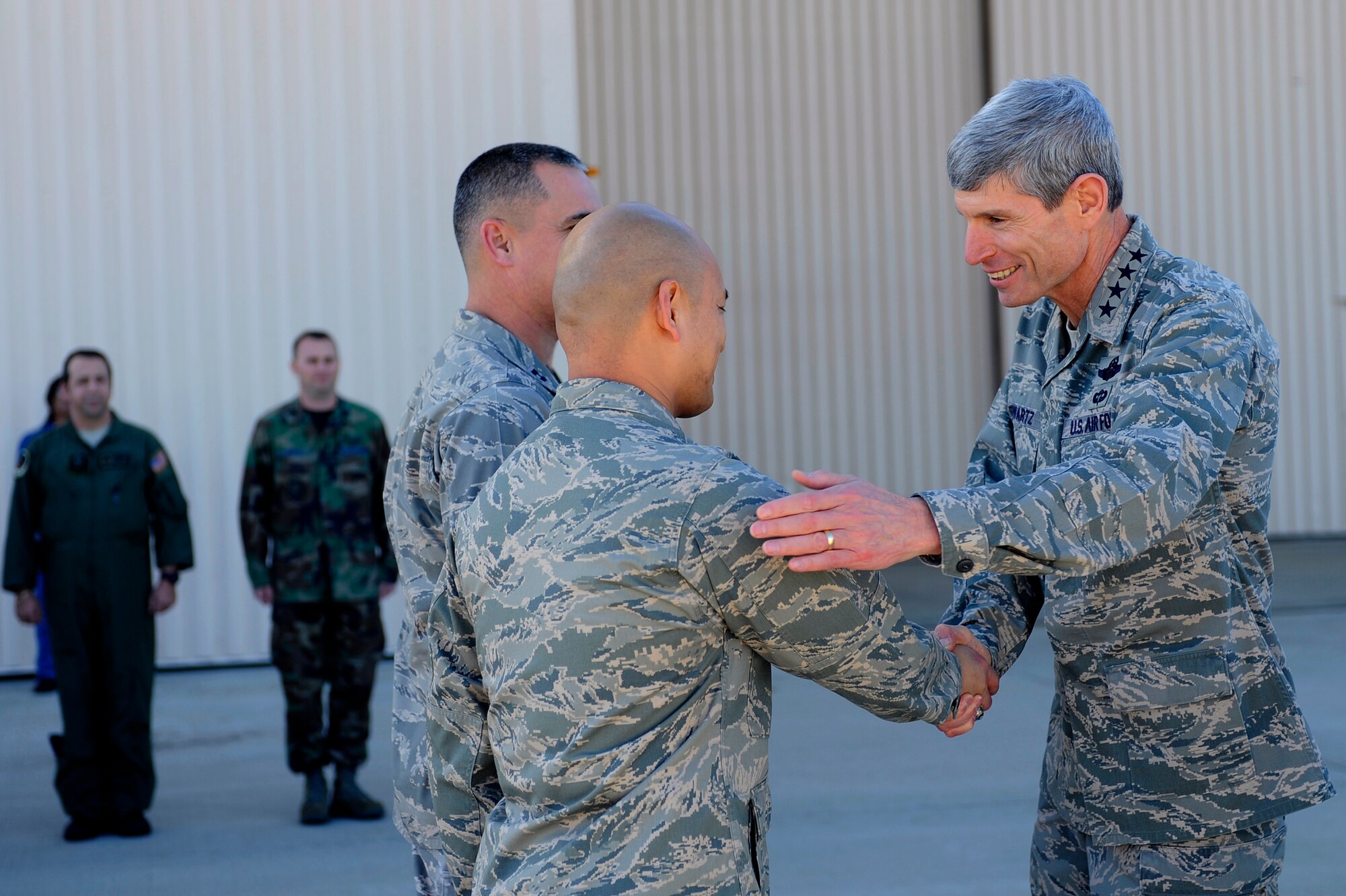 HURLBURT FIELD, Fla. -- Gen. Norton A. Schwartz, Chief of Staff of the U.S. Air Force, Washington, D.C., shakes the hand of Lt. Col Rene Leon, 1st Special Operations Aircraft Maintenance Squadron commander, during a visit here, Jan. 9. The General Schwartz met with Airmen assigned to the 15th Aircraft Maintenance Unit and toured a PC-12 Pilatus. 