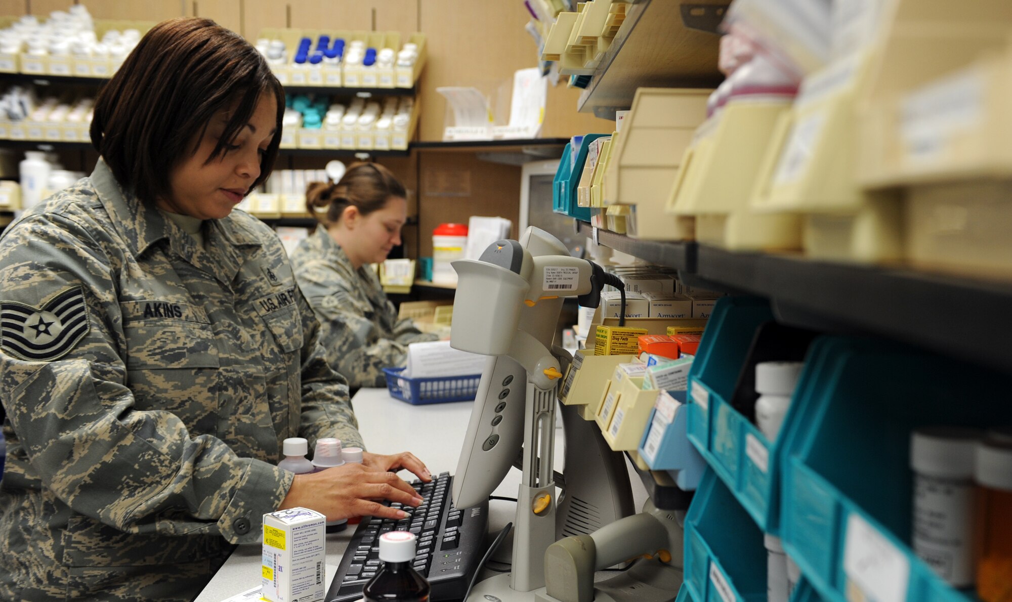 WHITEMAN AIR FORCE BASE, Mo. – Tech. Sgt. Knicole Akins, non-commissioned officer in-charge of pharmacy services, fills a prescription Jan. 14. She earned Air Combat Command Pharmacy NCO of the Year by launching a workload capture effort to convert age-old manual data input to new bar-code technology, saving hundreds of man-hours on over 122,000 records. (U.S. Air Force photo/Senior Airmen Stephen Linch)