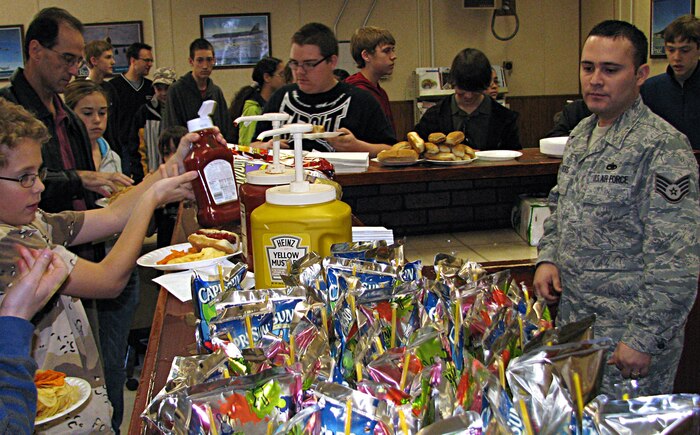 Staff Sgt. Jeffery Landeros, 372nd Training Squadron Det. 13 instructor, prepares food for members of the Henderson Nevada Homeschool Group during their tour of Det. 13 training facility Dec. 30. (Courtesy photo)