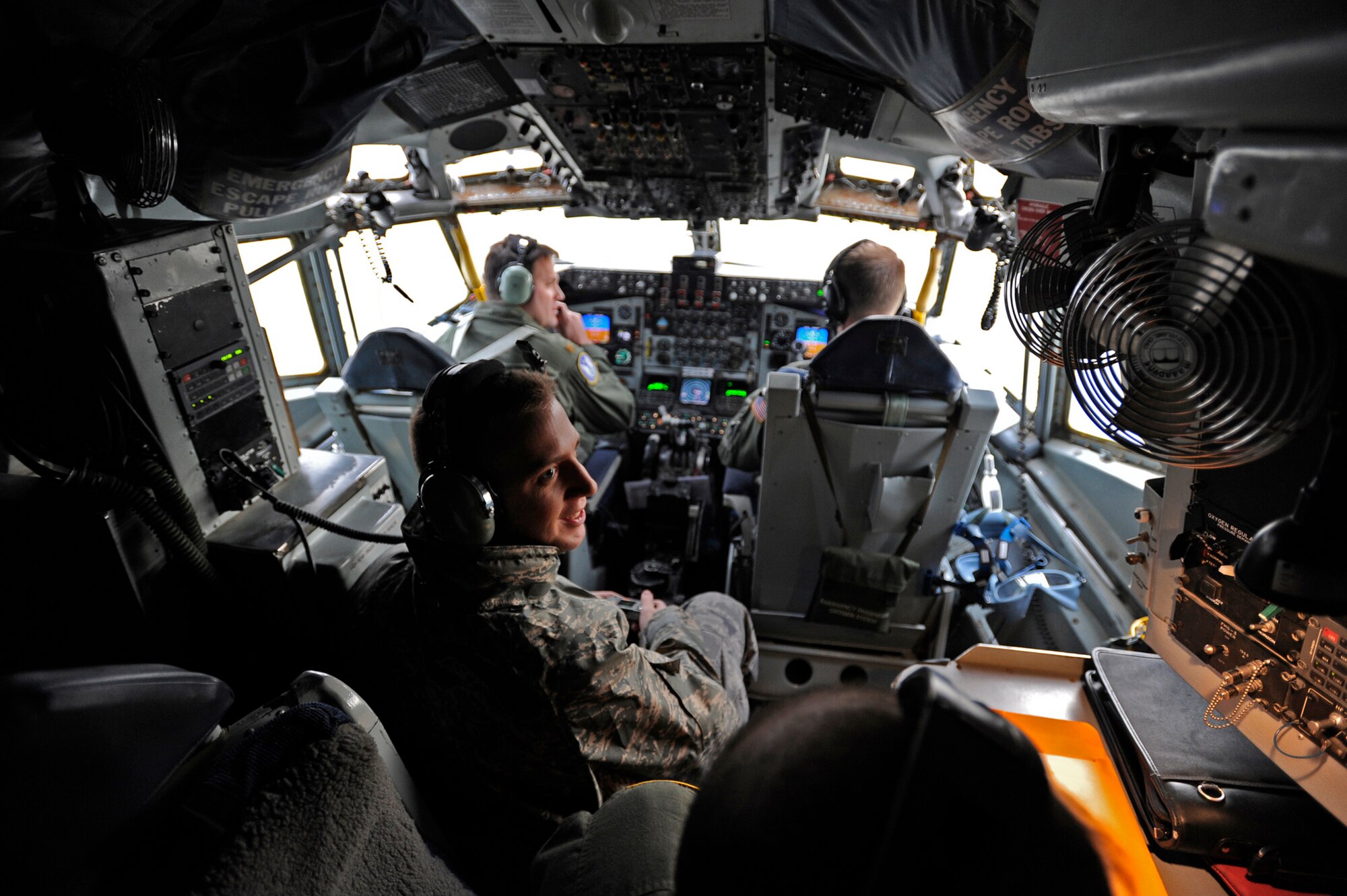 Airman 1st Class Matt Rourk takes a look around the cockpit of a KC-135 he flew in during the 931st Air Refueling Group's January drill weekend. Airman Rourk was part of a large group of active-duty Airmen who flew with a 931st crew to learn about aerial refueling, the primary mission at McConnell Air Force Base. The 931st ARG is an Air Force Reserve unit. Airman Rourk, a native of North Augusta, S.C., and his fellow active-duty passengers are assigned to the 22nd Air Refueling Wing, the 931st's host unit at McConnell. (U.S. Air Force photo/Tech. Sgt. Jason Schaap)