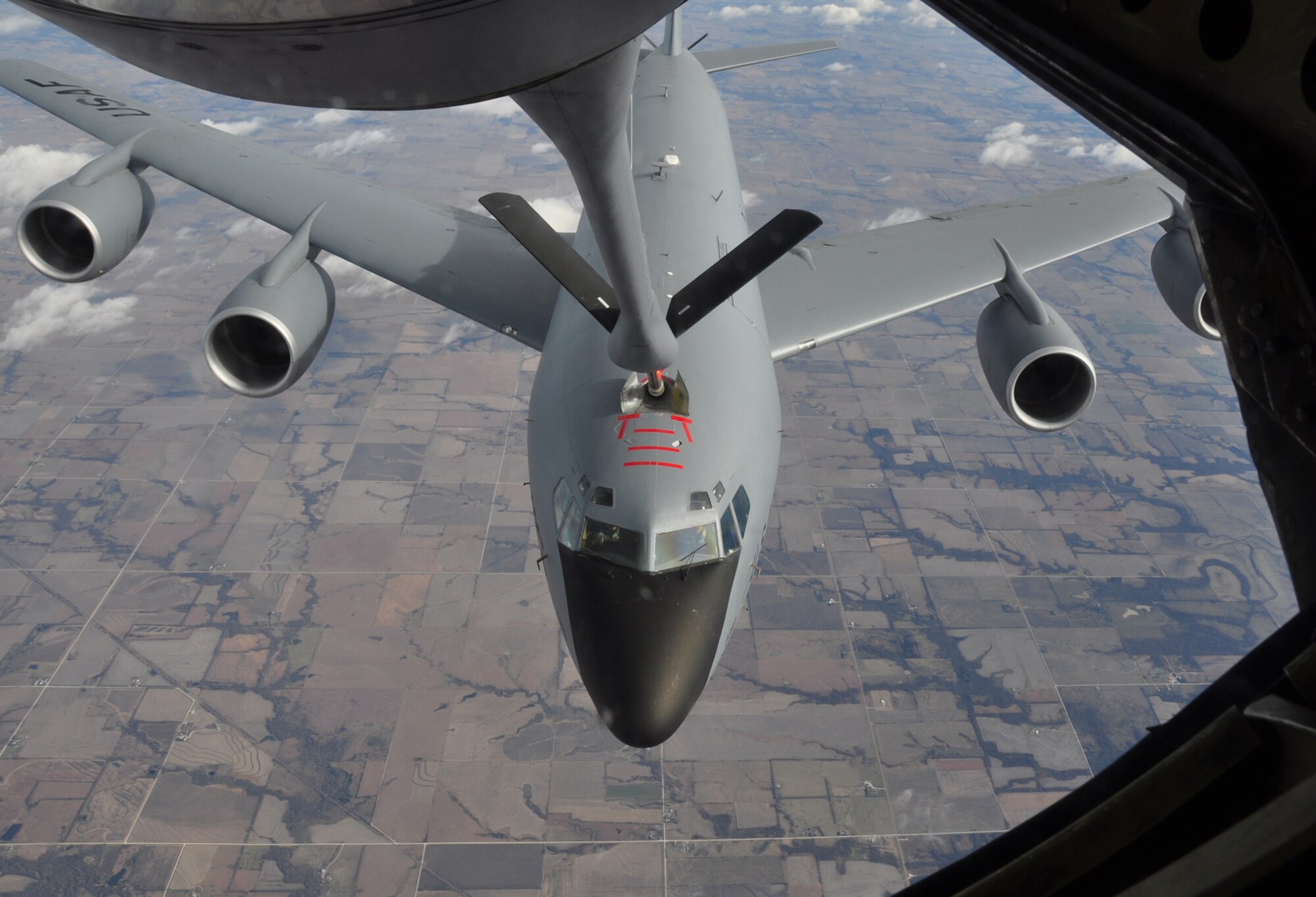 A KC-135 Stratotanker flown by active-duty pilots assigned to the 22nd Air Refueling Wing receives fuel from another KC-135 during a Team McConnell training mission. Flyers from the 22nd and Reservists assigned to the 931st Air Refueling Group have been teaming up during 931st drill weekends to enhance the aerial refueling mission at McConnell Air Force Base, Kan. (U.S. Air Force photo/Maj. Tsuyoshi Tung)  