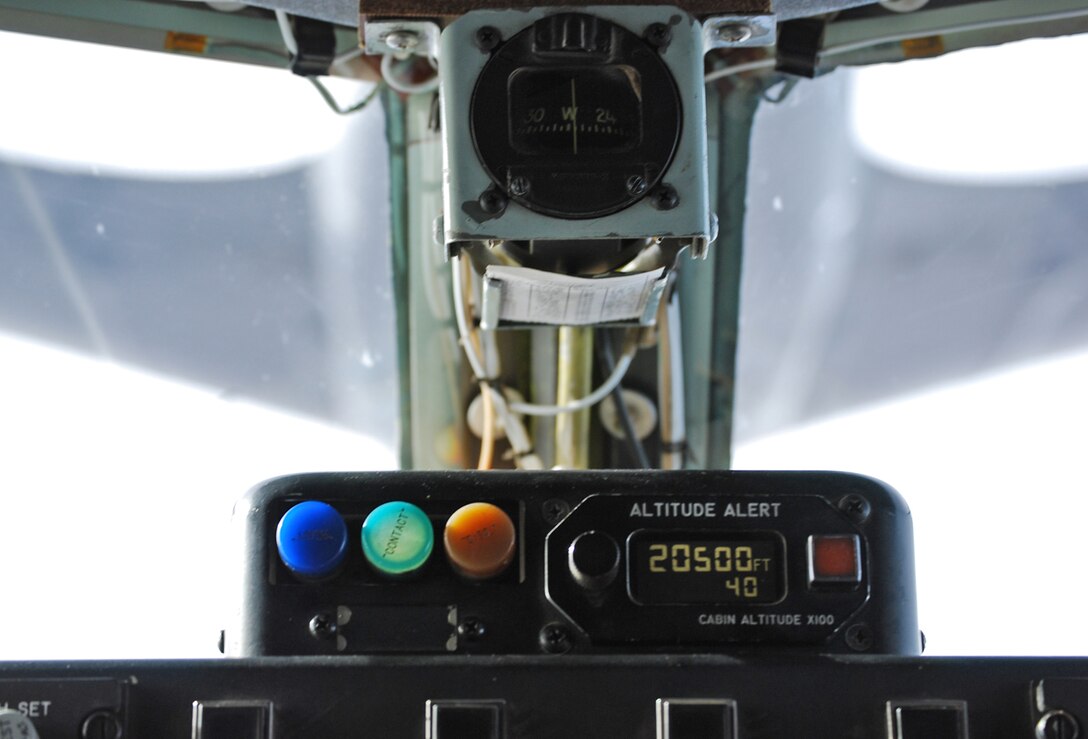 A green indicator notifies the crew of a KC-135 Stratotanker that the refueling boom from the KC-135 flying above them was in contact with their tanker. The Air Force's receiver-capable KC-135s are all assigned to McConnell Air Force Base, Kan. (U.S. Air Force photo/Tech. Sgt. Michael Kissire)