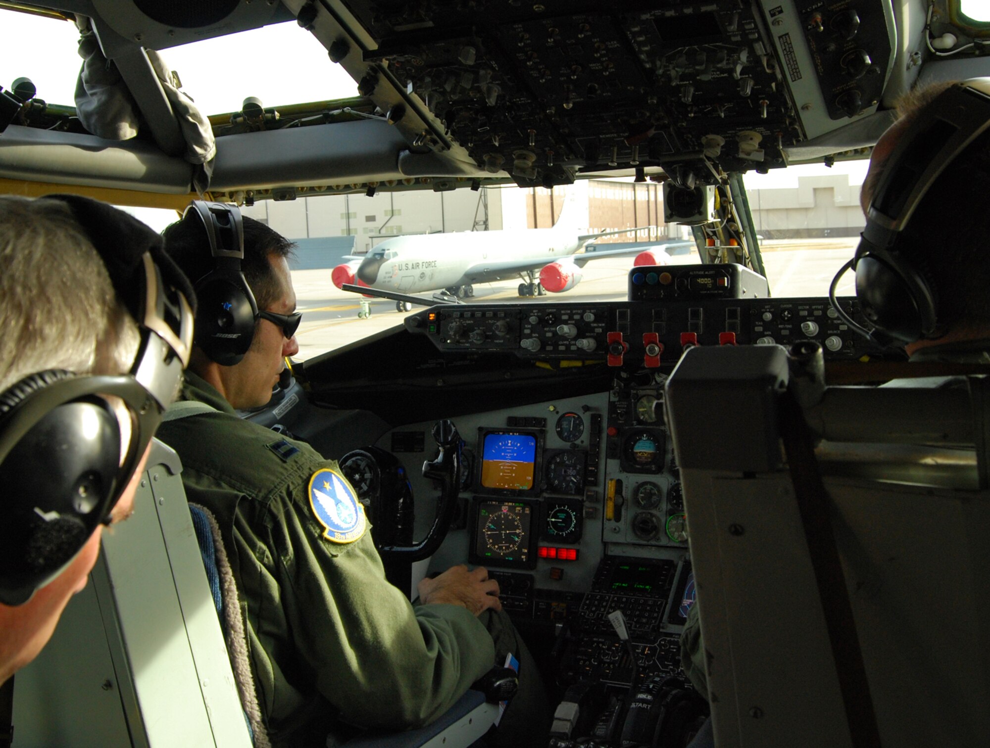 Capt. Mark Villacis (front left) prepares a KC-135 Stratotanker to take off from McConnell Air Force Base, Kan., for a total-force aerial refueling mission involving Reserve and active-duty Air Force flyers. Captain Villacis, a Reserve KC-135 pilot assigned to the 931st Air Refueling Group, is on active-duty orders with the 22nd Air Refueling Wing as a chief pilot in its Operations Support Squadron/Operations Support Training. The 22nd ARW is the 931st's host unit at McConnell. (U.S. Air Force photo/Tech. Sgt. Michael Kissire)