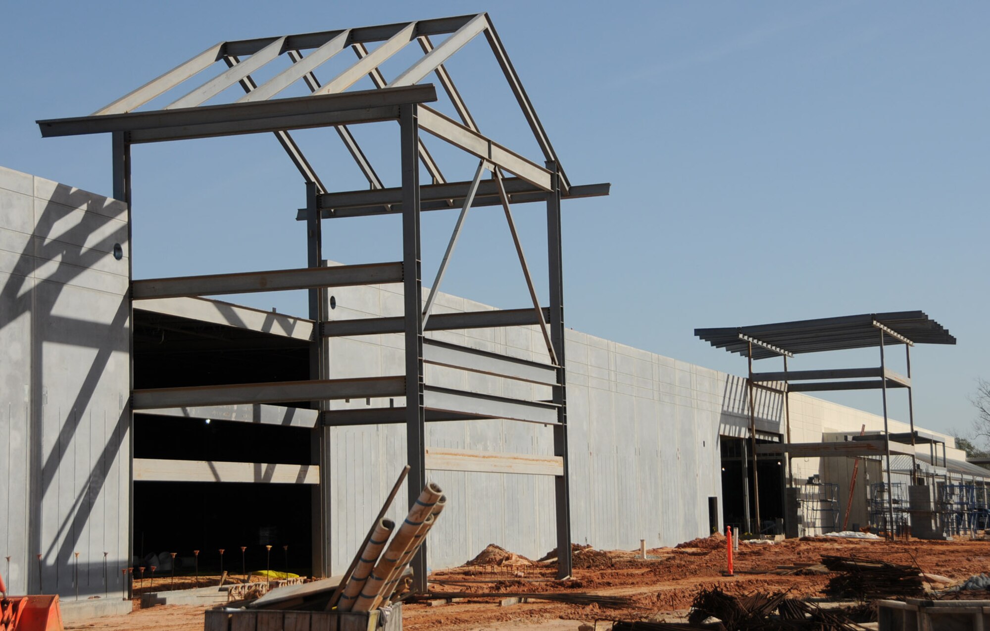 Left, the entrances to the base exchange and commissary are being erected.  (U.S. Air Force photo by Kemberly Groue)