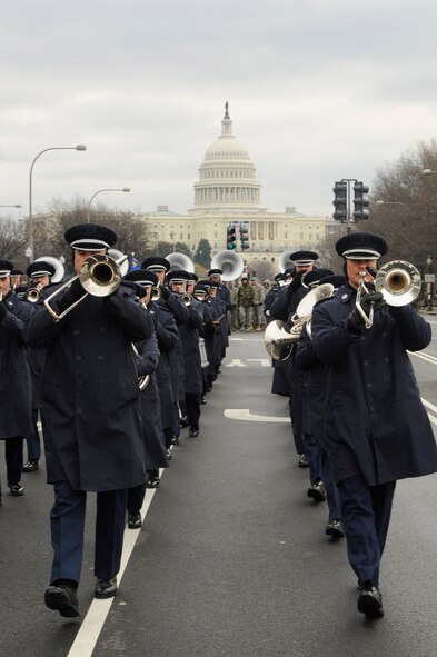 Members of the U.S. Air Force Band march down Constitution Avenue during a practice run of the inauguration parade for President-elect Barack Obama Jan. 11, 2009 in Washington, D.C.  “The inaugural period is a large-scale cooperative effort among federal, state and local agencies – it’s a great opportunity for our Airmen to work in a joint-interagency environment,” said Air Force District of Washington Commander Maj. Gen. Sharon K.G. Dunbar who also serves as the 320th Air Expeditionary Wing (AEW) commander.  (U.S. Air Force photo/Senior Airman Tim Chacon)
