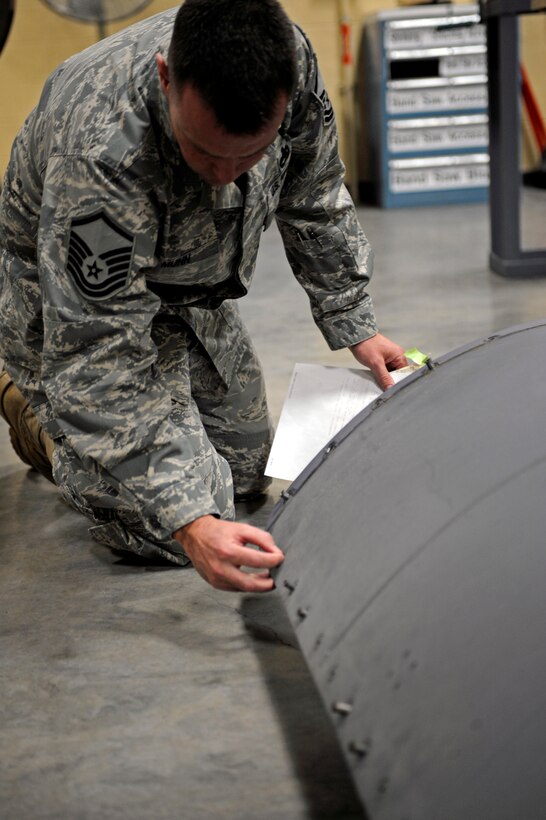 Master Sgt. Trey Munn, Air Combat Command fabrication evaluator, inspects B-1B Lancer parts repaired by the 28th Maintenance Squadron fabrication flight here Jan. 13.  Sergeant Munn is part of the Logistics Standardization and Evaluation Team which takes an in-depth look at the inner workings of all maintenance and logistics career fields. (U.S. Air Force photo/Airman 1st Class Matthew Flynn)