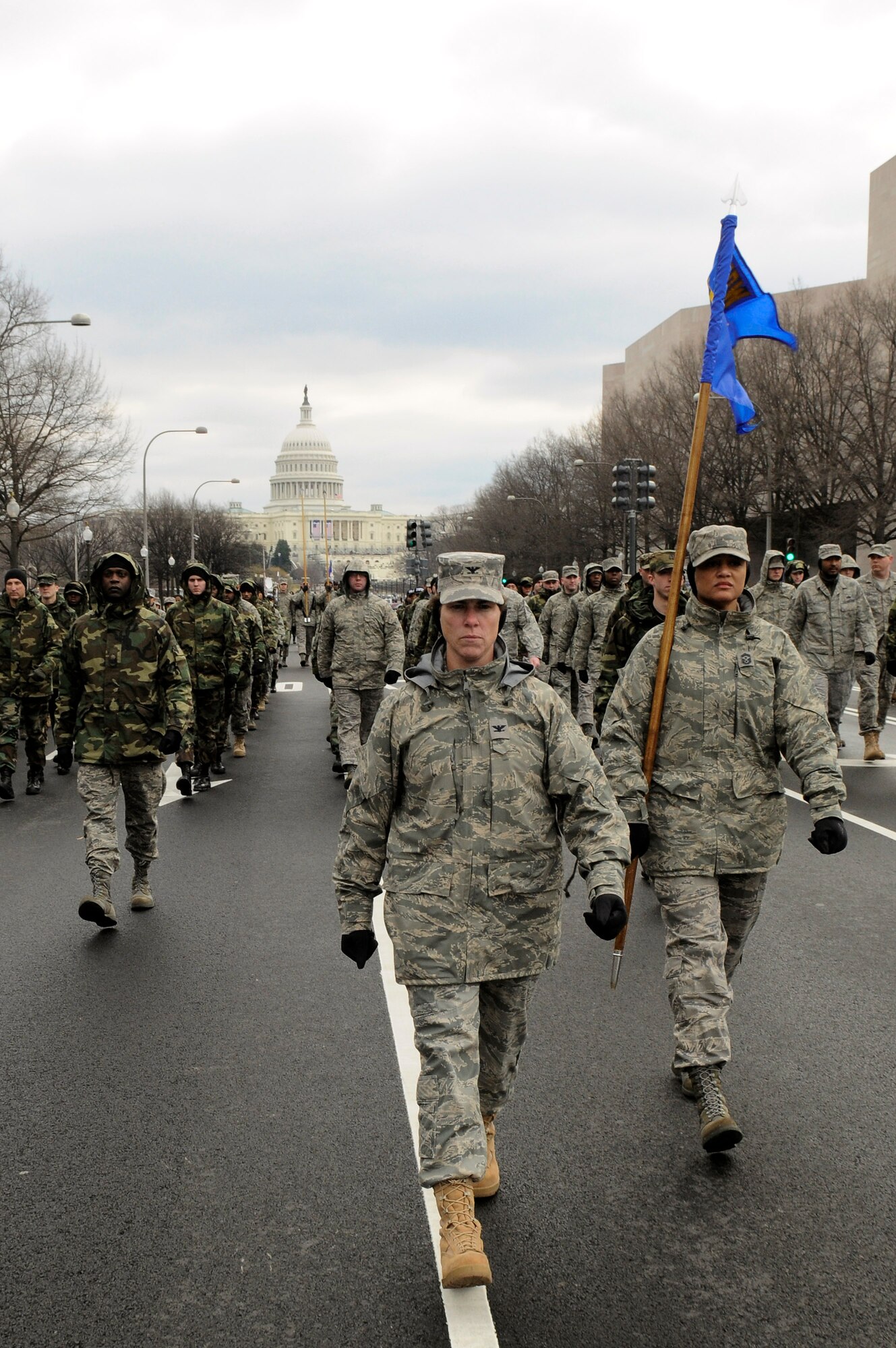Col. Elisabeth Borelli and Chief Master Sgt. Robin Johnson lead a flight of Airmen from the Air Force District of Washington down Constitution Avenue during a practice run of the inauguration parade for President-elect Barack Obama Jan. 11 in Washington, D.C. Colonel Borelli is the 11th Operations Group commander, and Chief Johnson is the 11th Wing command chief. (U.S. Air Force photo/Staff Sgt. Dan DeCook) 
