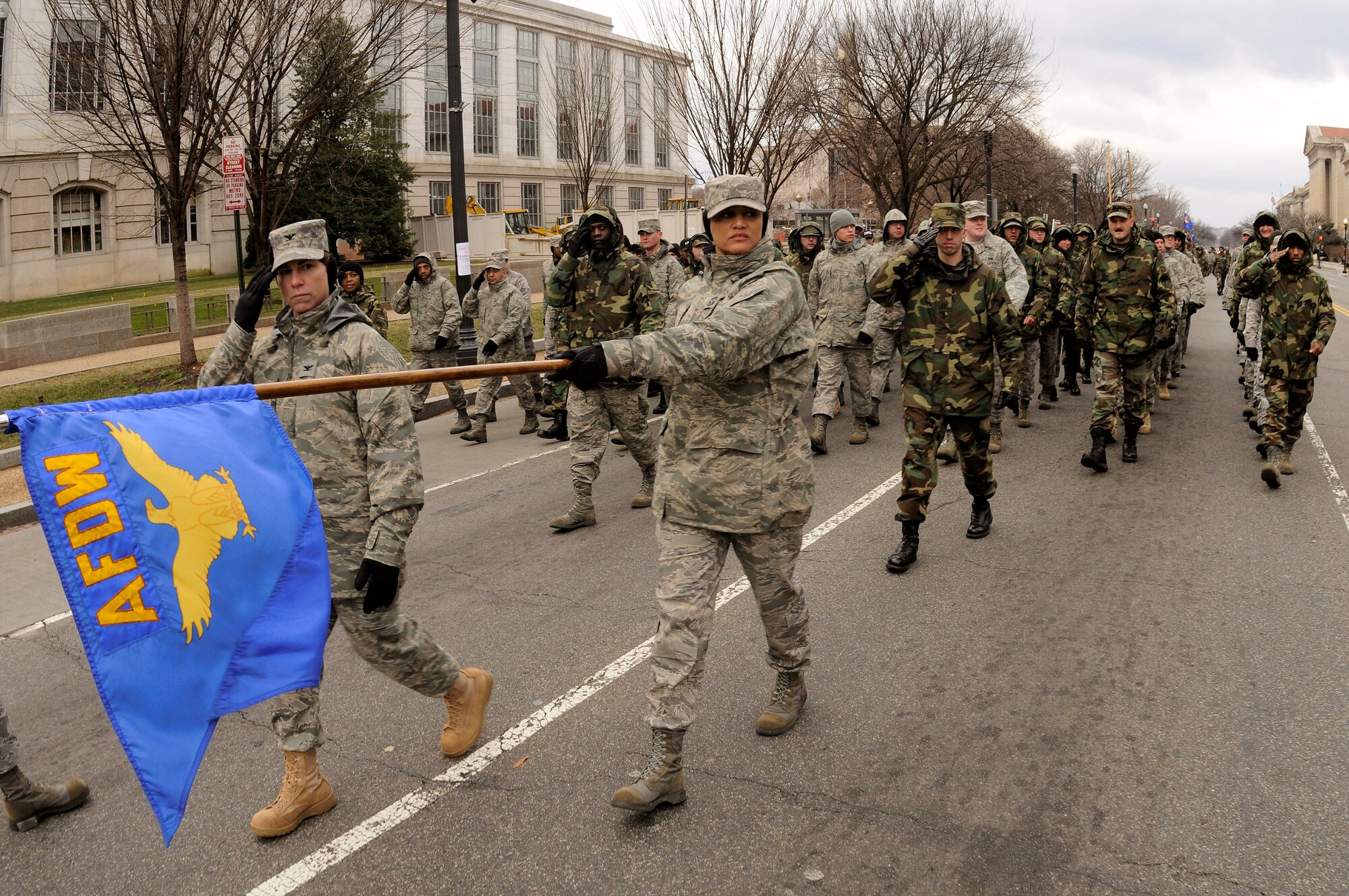 Col. Elisabeth B. Borelli and Chief Master Sgt. Robin Johnson lead a flight of Airmen from the Air Force District of Washington down Constitution Avenue during a practice run of the inauguration parade for President-elect Barack Obama Jan. 11 in Washington, D.C. Colonel Borelli is the 11th Operations Group commander, and Chief Johnson is the 11th Wing command chief. (U.S. Air Force photo/Staff Sgt. Dan DeCook) 
