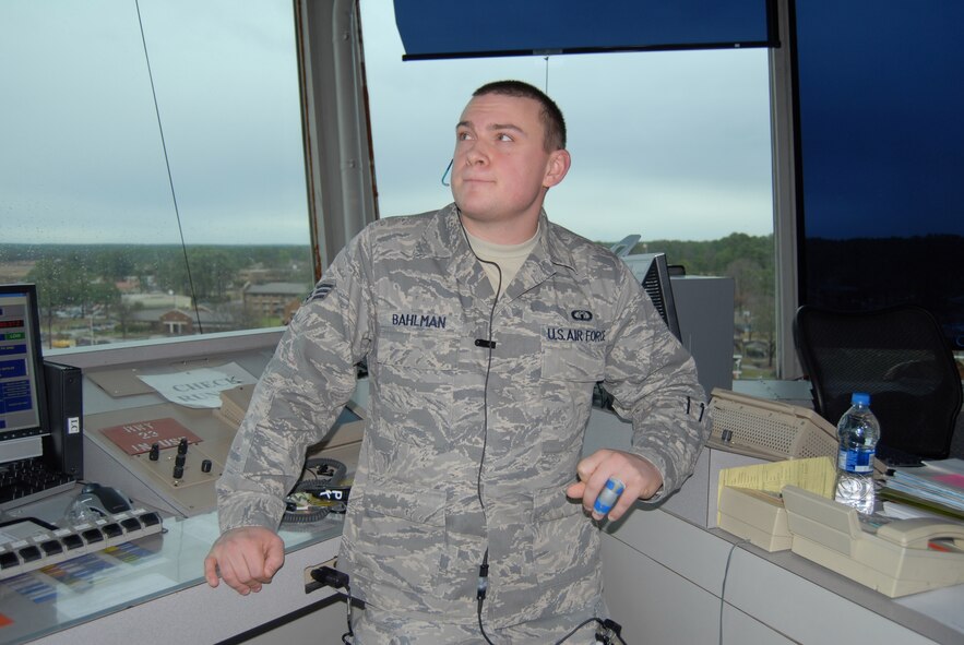 Senior Airman Christopher Bahlman, 43rd Operations Group, regulates air traffic operations inbound and outbound from Pope at the tower Jan. 7. (U.S. Air Force Photo by Airman 1st Class Mindy  Bloem)