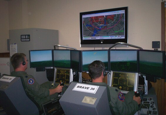 The Distributed Mission Operations system allows operators to hone their Homeland Defense skills using a combination of both real and virtual tools. Here, operators use simulators to train on a Homeland Defense scenario. (USAF Photo)