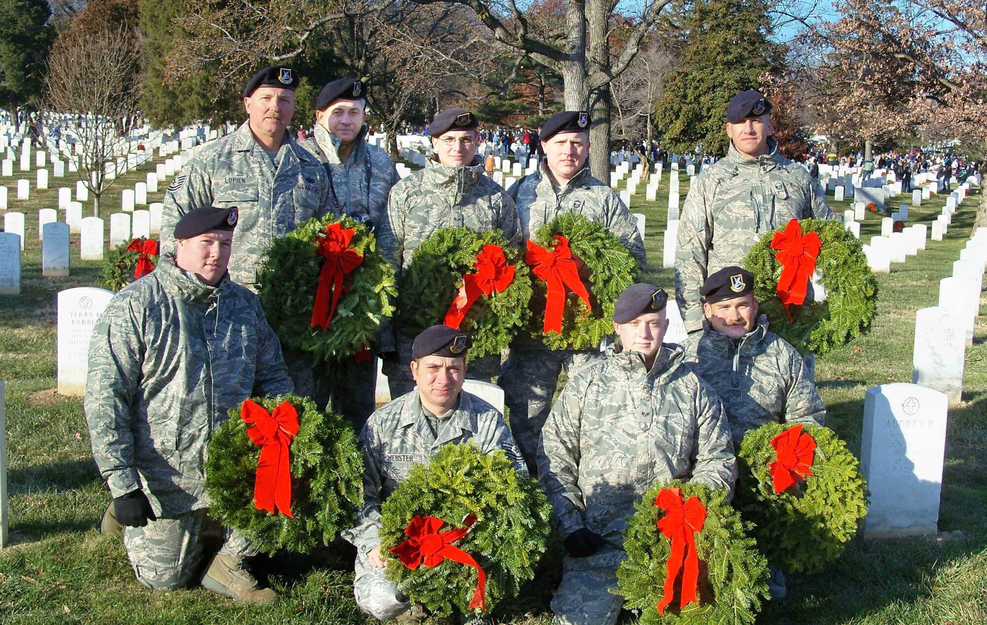 Members of the 439th Security Forces Squadron recently traveled to Arlington National Cemetery to place wreaths at the graves of the nation's veterans. They are:
Kneeling left to right: Staff Sgt. Matt Carroll, Tech. Sgt. Christopher Webster, Senior Airman Kelly Colkos, and Master Sgt. Duane Manville. Standing: Tech. Sgt. John Lupien, Master Sgt. Daniel Ernst, Senior Airman Christopher Cardella, Senior Master Sgt. Randy Bates, and Master Sgt. Charles Frey. (US Air Force photo/Tech. Sgt. Nadine Bates)