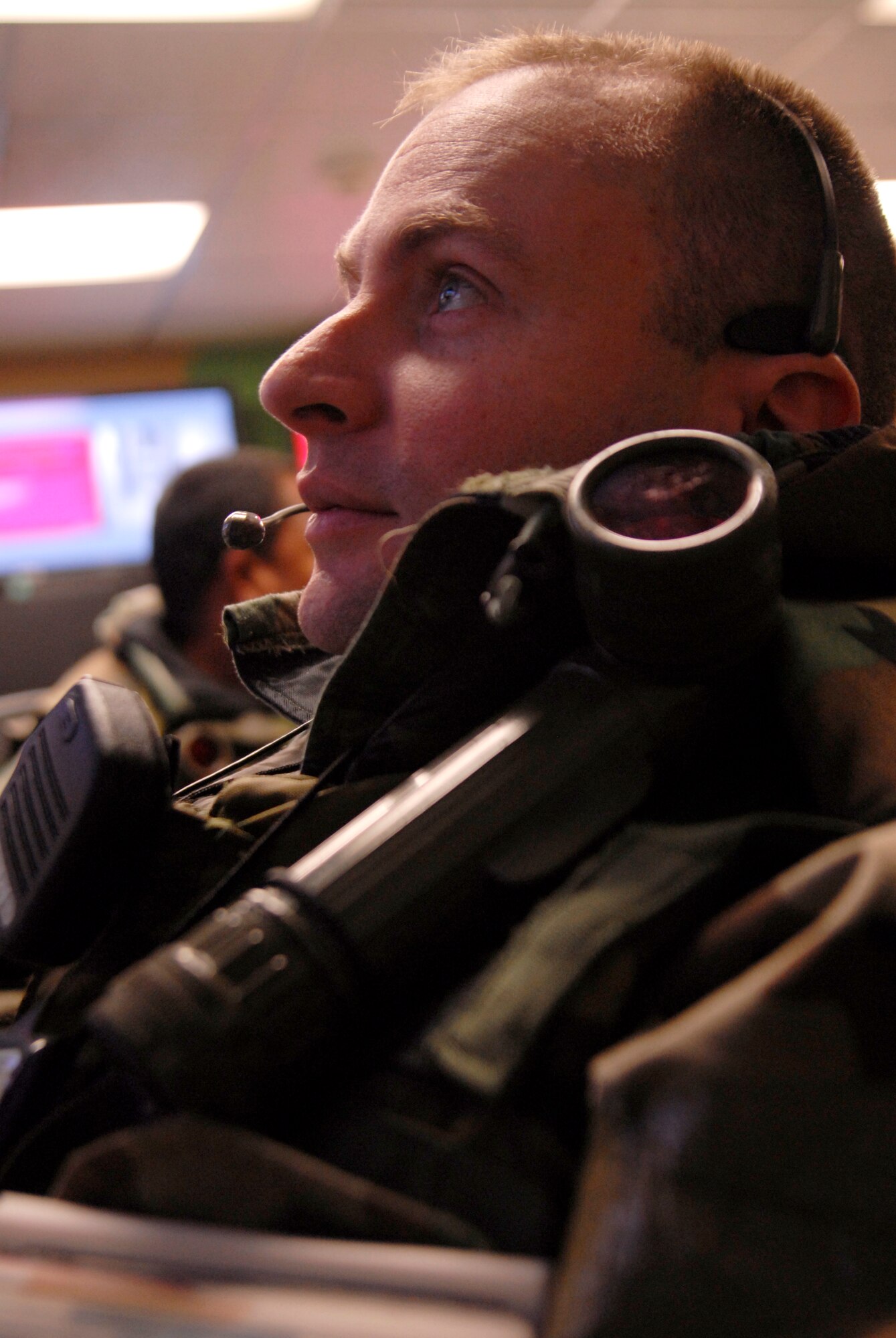 Major Bryan T. Eberhardt, 8th Communications Squadron commander, speaks on a conference call while working in the Unit Control Center during the Peninsula Wide Operation Readiness Exercise at Kunsan Air Base, Republic of Korea, Jan. 14, 2009. (U.S. Air Force Photo by SSgt Jason Colbert)
