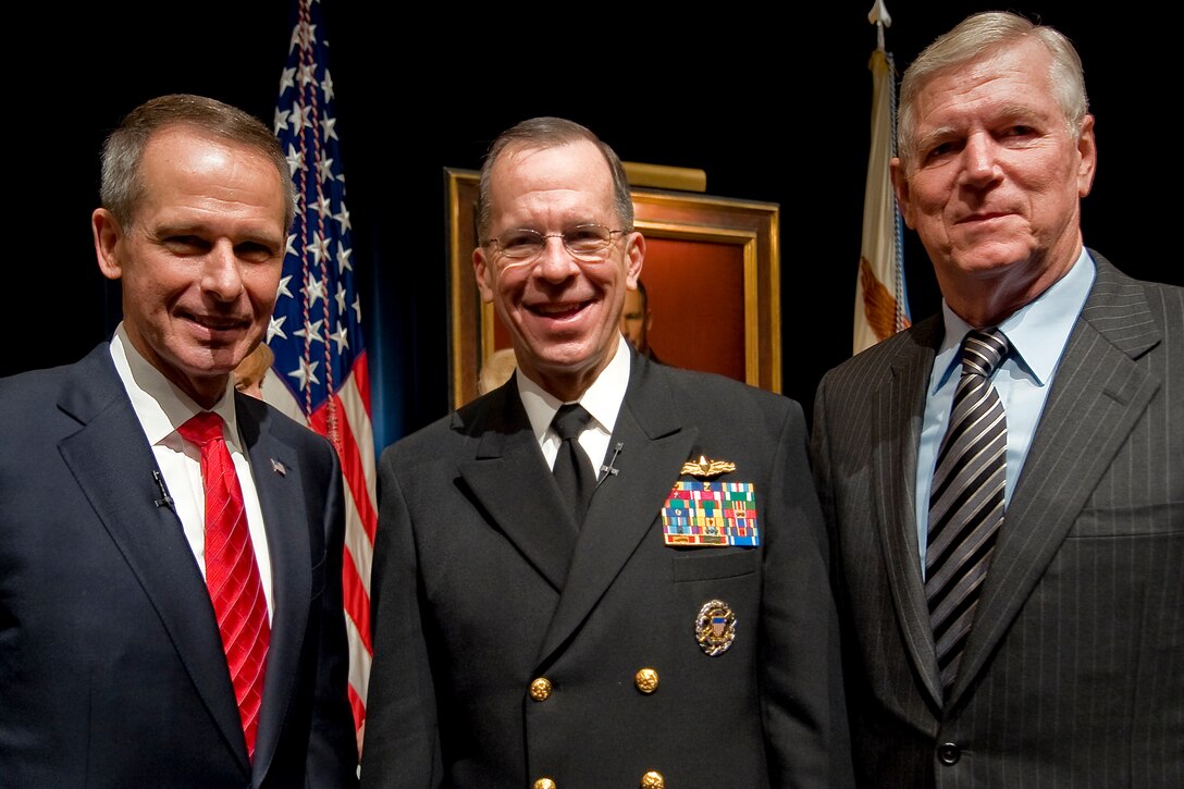 Retired U.S. Marine Gen. Peter Pace, 16th chairman of the Joint Chiefs of Staff, current Chairman U.S. Navy Adm. Mike Mullen and retired U.S. Air Force Gen. Richard Myers,  15th chairman, pose for a photo at the conclusion of Pace's portrait unveiling at the Pentagon, Jan. 13, 2009.  The portrait of Pace places the former senior military leader on a simple red background where he looks back at the viewer. It is on display in the Pentagon along with portraits of other former chairmen.