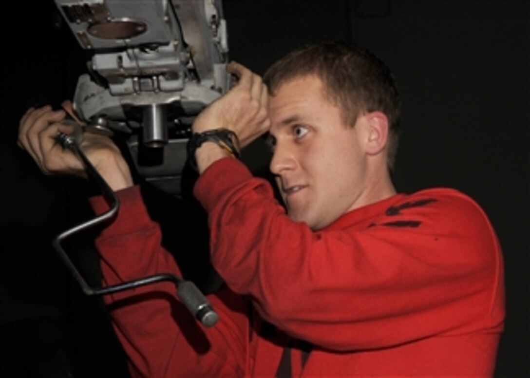 U.S. Navy Petty Officer 3rd Class Mathew Carrell inspects an F/A-18 Super Hornet aircraft aboard the aircraft carrier USS Theodore Roosevelt (CVN 71) underway in the Gulf of Oman on Jan. 11, 2009.  The ship and Carrier Air Wing 8 are conducting operations in the U.S. 5th Fleet area of responsibility.  
