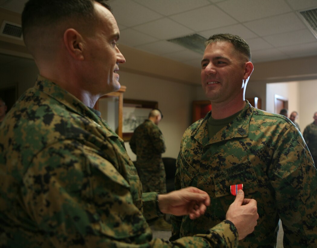 Gunnery Sgt. Joshua L. Draper is awarded a Bronze Star Medal for his actions in support of Operation Iraqi Freedom, here, Jan. 14.  Draper served as a logistics advisor for Military Transition Team 0132, 1st Iraqi Army Division, I Marine Expeditionary Force, from October 2007 to October 2008, where he acted as a leader and a mentor to his Marines as well as to his Iraqi counterparts.