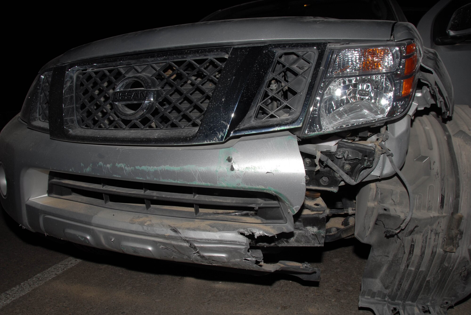 SOUTHWEST ASIA -- A government leased vehicle sits on a road after a traffic accident here. A minor vehicle accident can result in seven to 12 hours of additional work for 380th Air Expeditionary Wing personnel and a major accident can add 16 hours to several days of work. (U.S. Air Force photo by Tech. Sgt. Christopher Campbell) (Released)