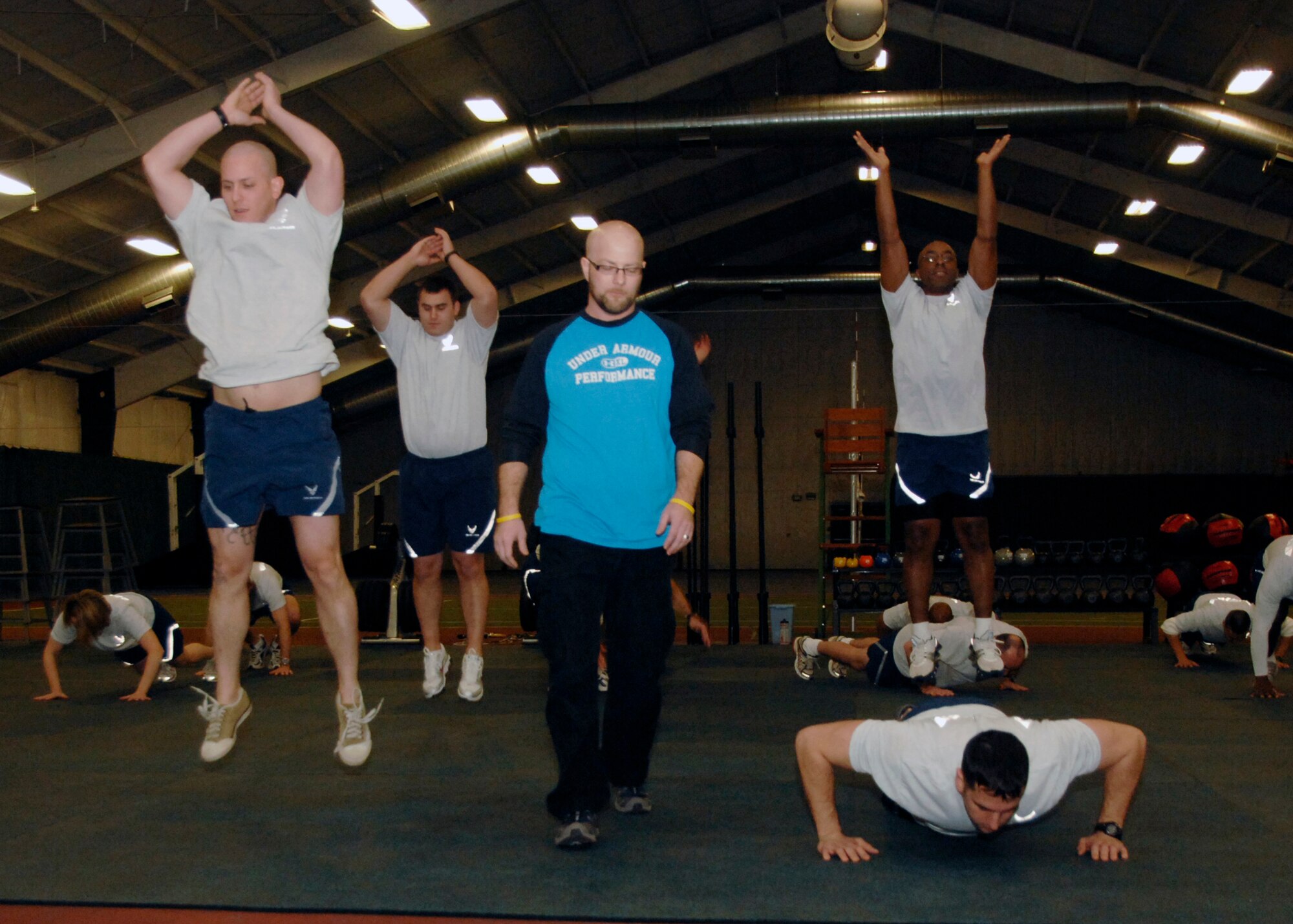 Commanders, superintendents and Team Andrews members give their best in the inaugural exercise session at the Tactical Fitness Center Jan. 15. The program builds core strength and endurance that are fundamental to a superior level of combat fitness, both as indiviuals and teams. The new Tactical Fitness Center replaces the multi-purpose room at the West Fitness Center. Class schedules will be posted at the main entrance of the fitness center, and individuals can work out in the the new TFC during normal operations. (U.S. Air Force photo by Airman 1st Class Melissa Rodrigues)