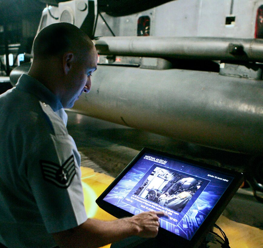 Staff Sgt. Jason Kinney uses a touch screen at the new Warrior Airmen exhibit at the National Museum of the U.S. Air Force. The exhibit in the Cold War Gallery shows the role that Air Force peoplel have played in operations Enduring Freedom and Iraqi Freedom.  (U.S. Air Force photo/Ron Alvey)