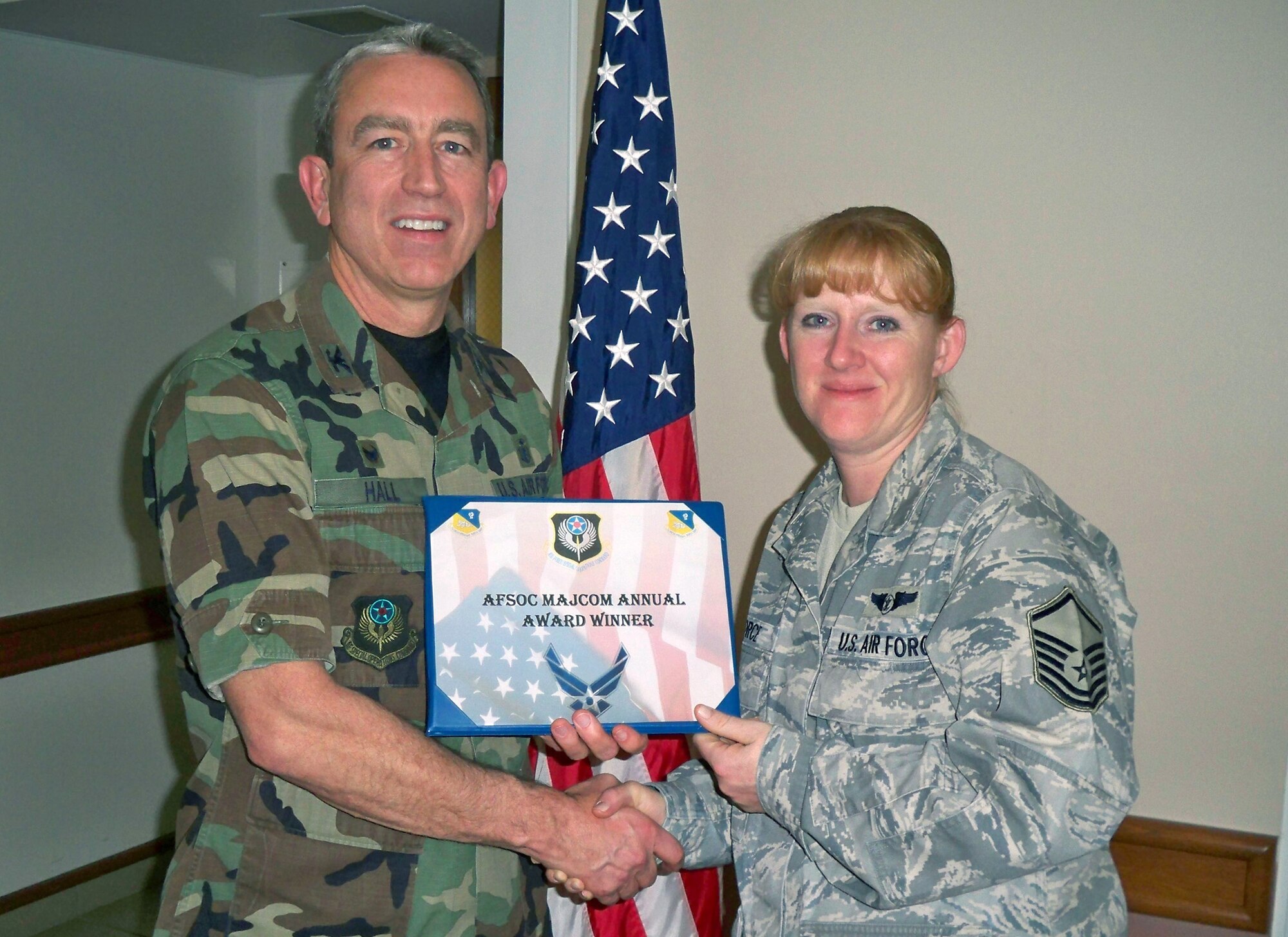 CANNON AIR FORCE BASE, N.M.-- Col. Kenneth hall, 27th Special Operations Medical Group Commander, awards Master Sgt. Jannessa Force, 27th Special Operations Medical Group, with the 2008 Air Force Special Operations Command Outstanding Clinical Medical Technician Senior SNCO Award Jan. 8. Sergeant Force was also the nominee for the Brigadier General Sarah Wells Outstanding SNCO of the Year Award. (Courtesy photo)