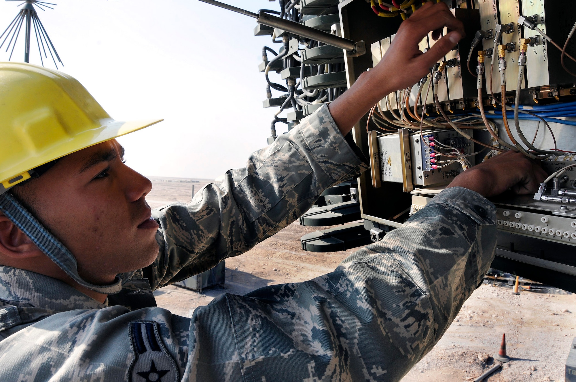 Airman 1st Class William Lundy adjusts a receiver assembly Dec. 30, 2008, at an air base in Southwest Asia. Airman Lundy is a radar maintenance technician assigned to the 71st Expeditionary Air Control Squadron. The radar maintenance team assures that the radars remain in good working condition and calibration. The radars provide an extensive radar presence over the entire Arabian Gulf region. Airman Lundy is a native of Clarksville, Tenn. (U.S. Air Force photo/Tech. Sgt. Michael Boquette) 
