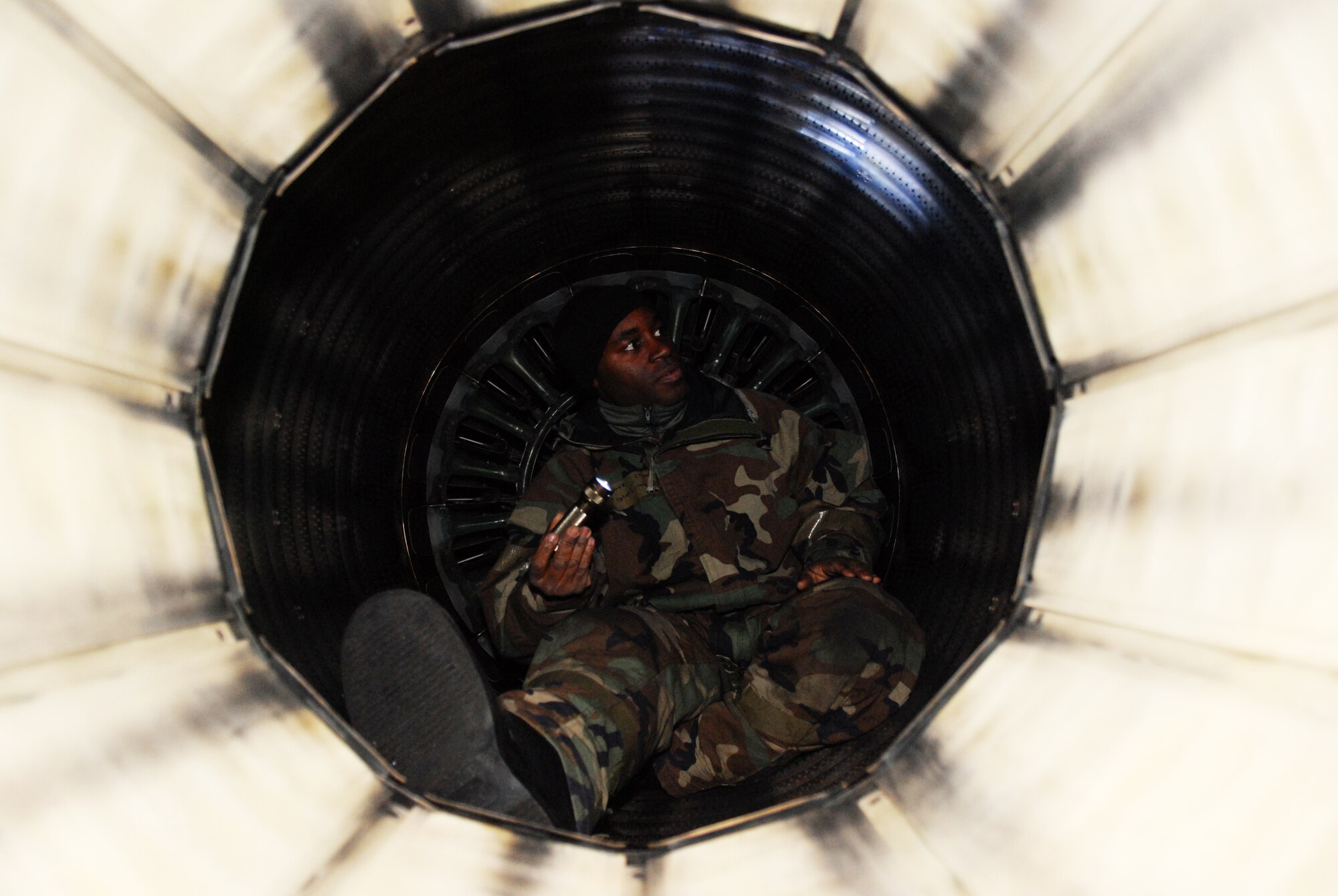 Staff Sgt. Isaiah English conducts an exhaust inspection on an F-16 Fighting Falcon during the Peninsula-Wide Operational Readiness Exercise Beverly Bulldog 09-01 Jan. 14, 2009 at Kunsan Air Base, Republic of Korea. Sergeant English is a crew chief assigned to the 8th Aircraft Maintenance Squadron's 80th Aircraft Maintenance Unit. (U.S. Air Force Photo by Senior Airman Gustavo Gonzalez) 
