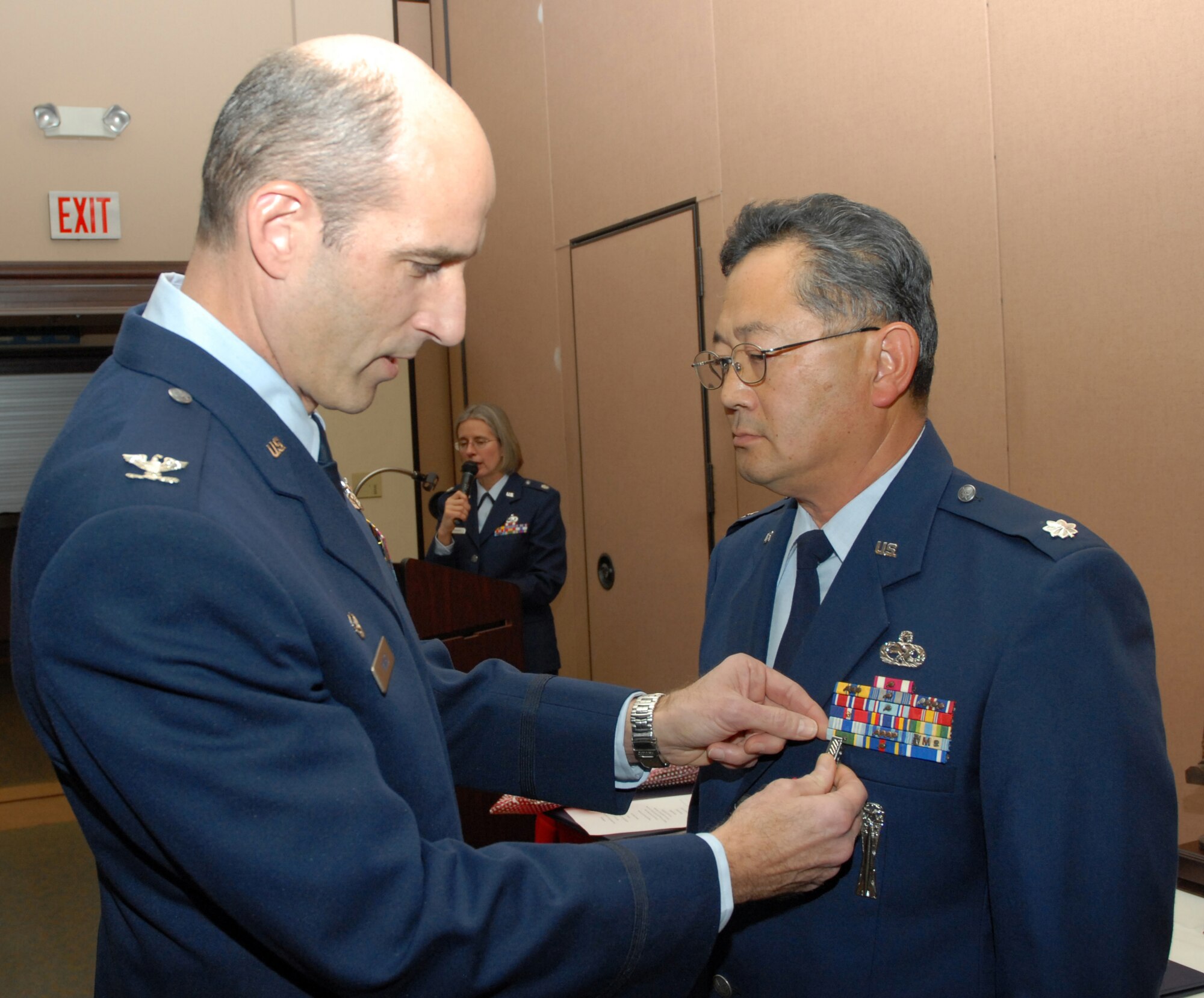 BEALE AIR FORCE BASE, Cailf. -- 940th Air Refueling Wing commander Col. Jeffrey "Sal" Mineo pins the Meritorious Service medal on Air Force Reservist, Lt. Col. Djoko Soejoto during his retirement ceremony here, Jan. 10, 2009. Lt. Col. Soejoto retired from the Air Force Reserve after 31 years of honorable service. He has served in various leadership positions within the 940th ARW. It was the first retirement ceremony for Col. Mineo as wing commander.  
(U.S. Air Force Photo/ Tech. Sgt. Luke Johnson)