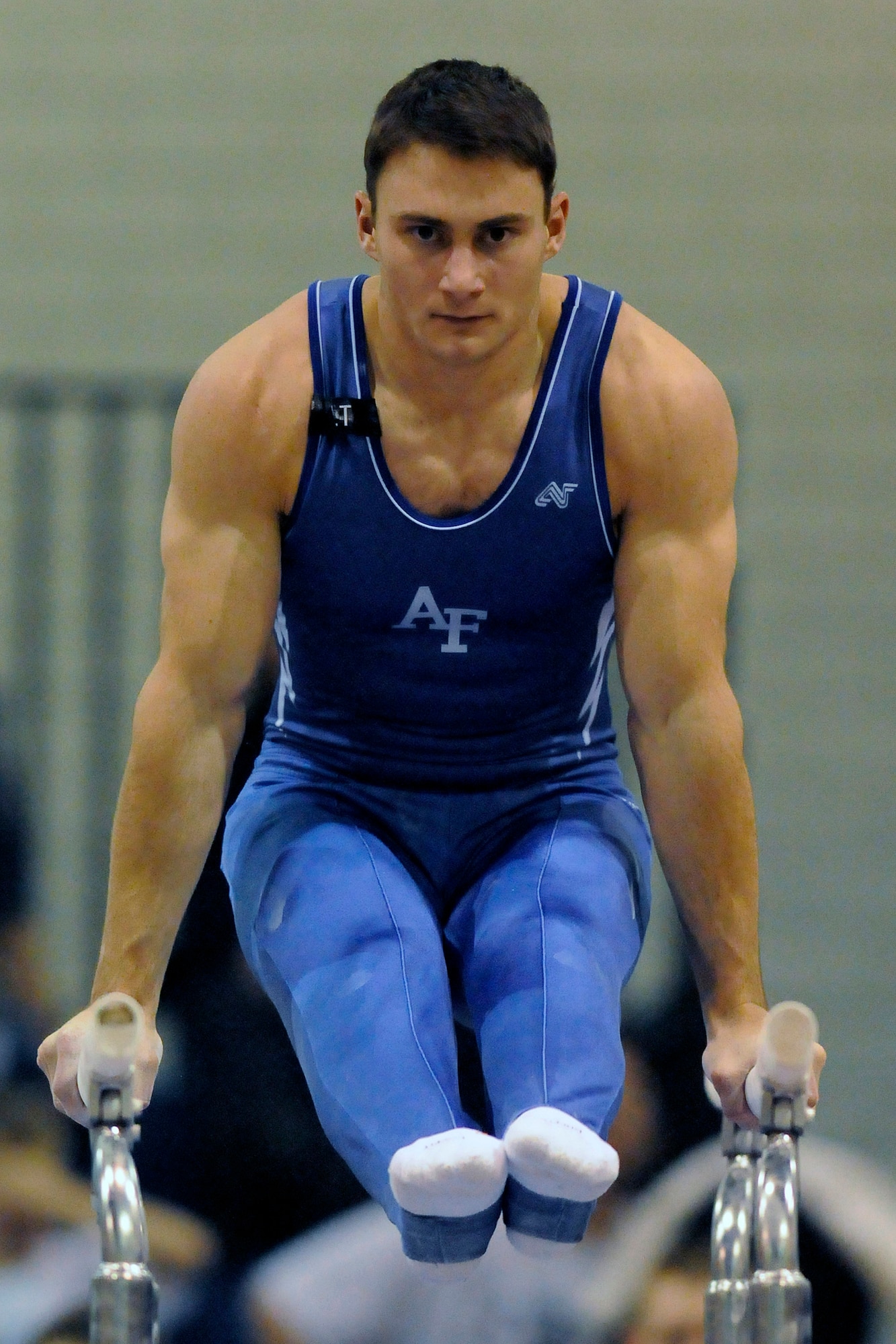 U.S. Air Force Academy sophomore Matt Thorne perfoms a routine on the parallel bars during the annual Rocky Mountain Open Jan. 10 at the Academy in Colorado. The Falcons men's gymnastics team accounted for seven top-10 finishes as they placed third overall in the meet in front of a capacity crowd. (U.S. Air Force photo/Mike Kaplan)
