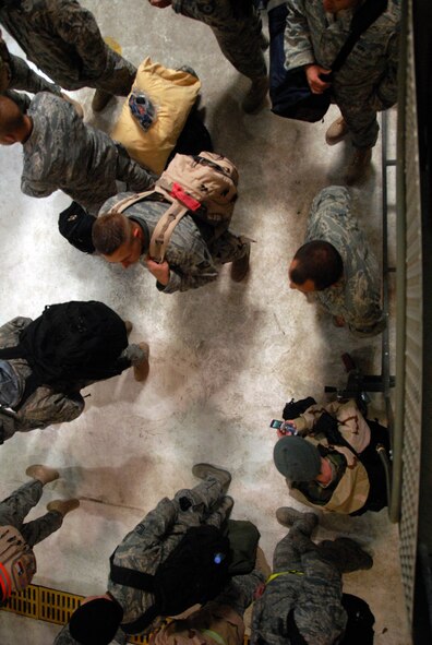 Approximately 140 180th Fighter Wing personnel return home
from an Air Expeditionary Forces rotation to Balad Air Base December 12, 2008.
The members were greeted by about 300 family members and well-wishers who
waited patiently in the hangar to be reunited with their loved ones who had been
on this deployment since October, 2008.

USAF Photo by Senior Airman Jodi Leininger