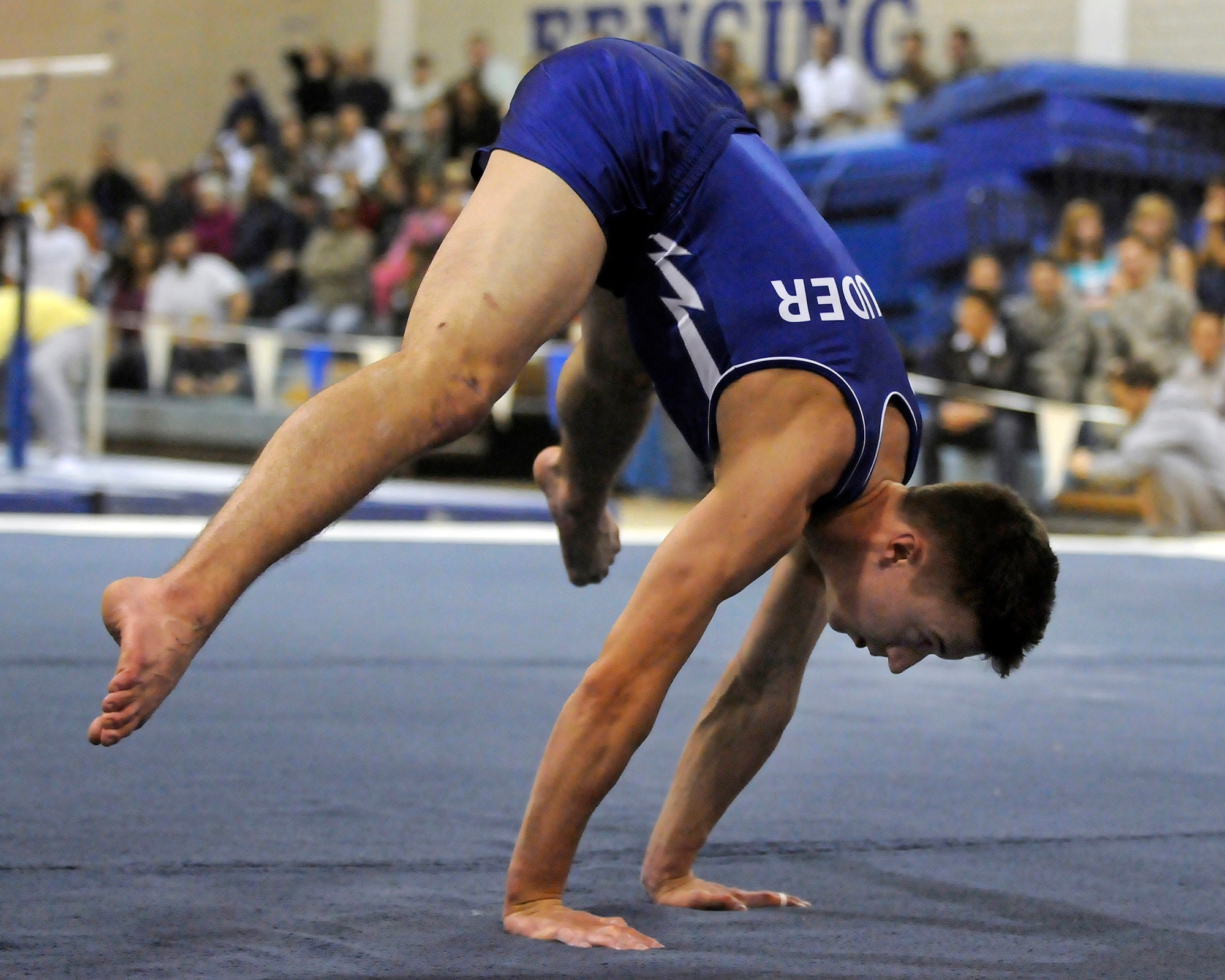 U.S. Air Force Academy freshman Jacob Houder competes in the floor exercise during the annual Rocky Mountain Open Jan. 10 at the Academy in Colorado. The Falcons accounted for seven top-10 finishes as they placed third overall in the meet in front of a capacity crowd. (U.S. Air Force photo/Mike Kaplan)