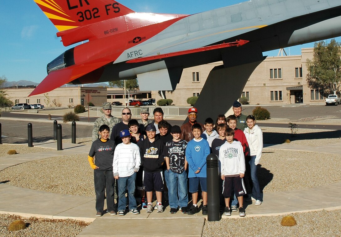 Students with the Valley Christian Academy visit Luke Air Force Base, Ariz., during their fall break Dec. 30, 2008. During their tour, the students toured the fire department and got to see an F-16 up close as part of the 944th Fighter Wing's second annual Career Day. Other demonstrations were provided by the 56th Security Forces Squadron and the 56th Civil Engineer Squadron Explosive Ordnance Disposal flight. Lt. Col. (ret.) Robert Ashby, an Original Tuskegee Airman, was also in attendance to discuss his experiences of desegregating the Air Force during World War II. The students ended the day with a basketball clinic at the fitness center. (U.S. Air Force photo/Tech. Sgt. Susan Stout)