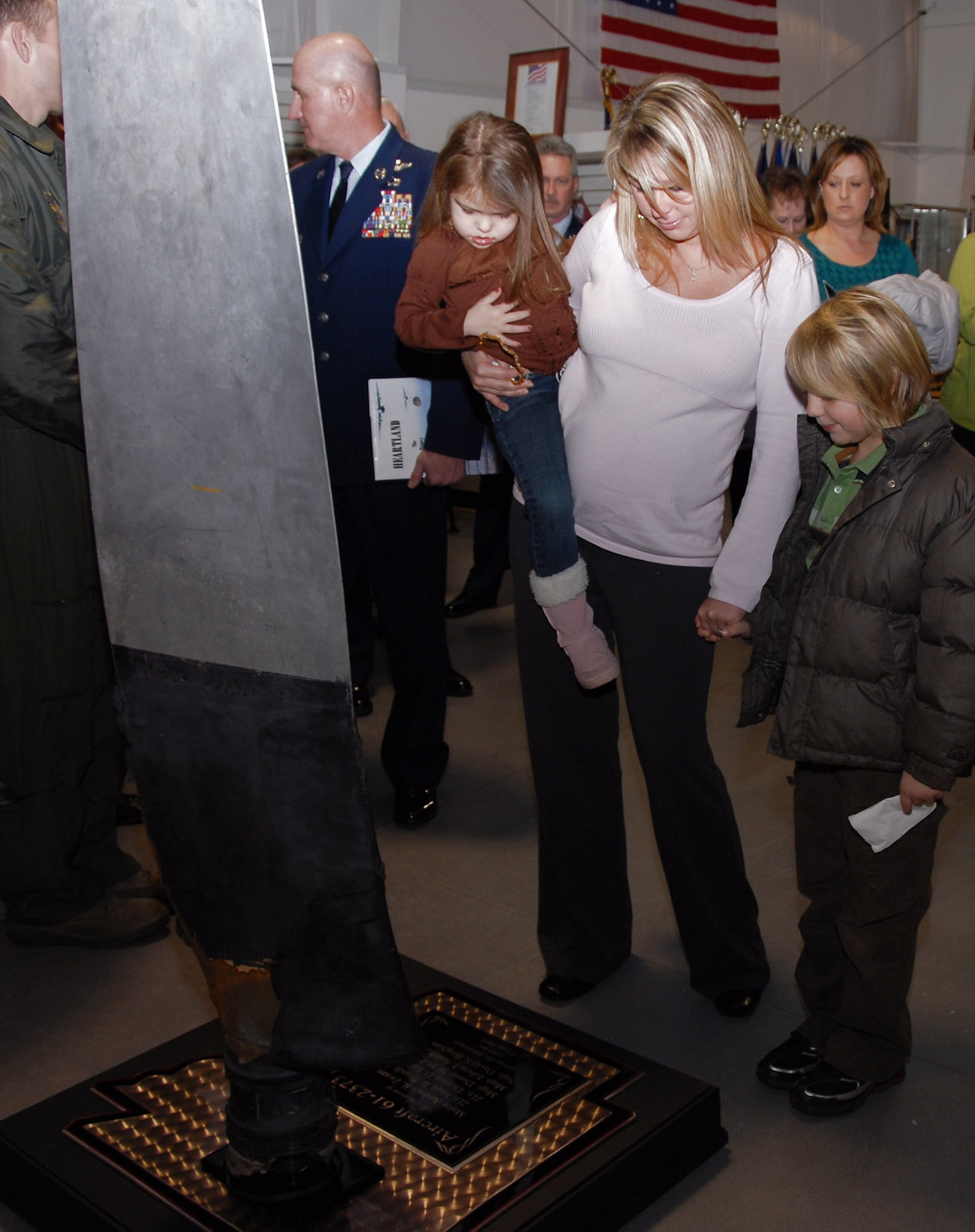 Master Sgt. Danny Holland's daughter, Terri Mitchell, with her children Blake and Danyell attended the memorial dedication Jan. 13 at the Jacksonville Museum of Military History in Arkansas. Sergeant Holland was one of six aircrew members killed onboard a C-130 Hercules that crashed June 8, 1988, during a training mission near the Greenville airport in Mississippi. (U.S. Air Force photo/Master Sgt. Dianna Seerey)