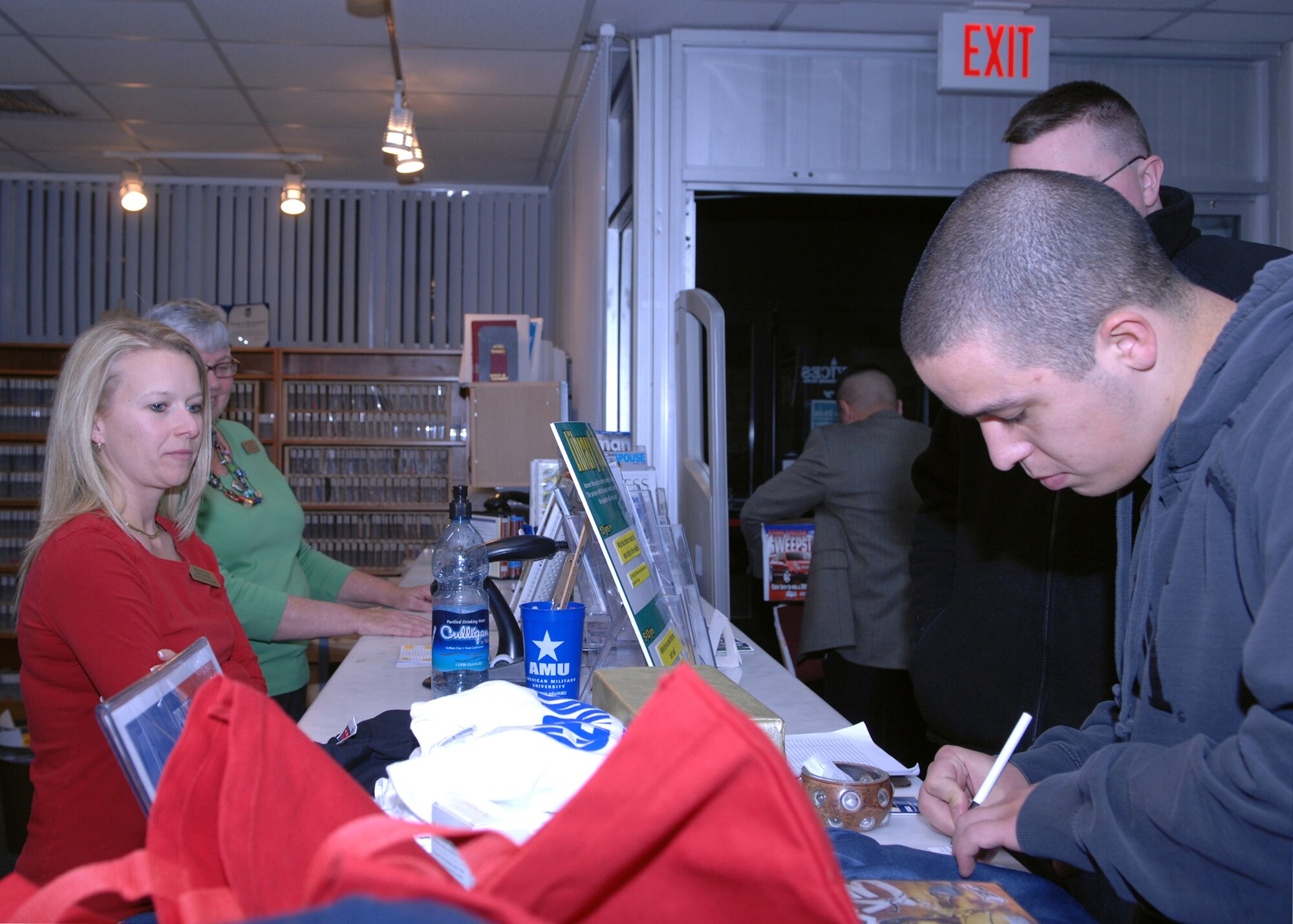 An Incirlik member enters a raffle during the “Late night at the Library” event March 14. The event was sponsored by Project Cheer, a United States Air Forces in Europe program designed to enhance the quality of life for single and unaccompanied Airmen. Project CHEER stands for creating hope, energy, enthusiasm and recreation for our young Airmen and runs annually from November through March. (U.S. Air Force photo/Senior Airman Erica Stewart)