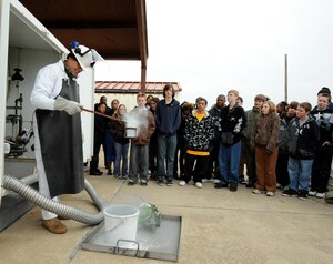 LANGLEY AIR FORCE BASE, Va. -- Students from Gildersleeve Middle School and Menchville High School listen to James Baldwin, 1st Logistics Readiness Squadron fuels distribution system operator, give a presentation on liquid oxygen during a tour of Langley Jan. 13. The students are part of a youth program that emphasizes workplace readiness training, college preparation, and career exploration. (U.S. Air Force photo/Airman Rebecca Montez)